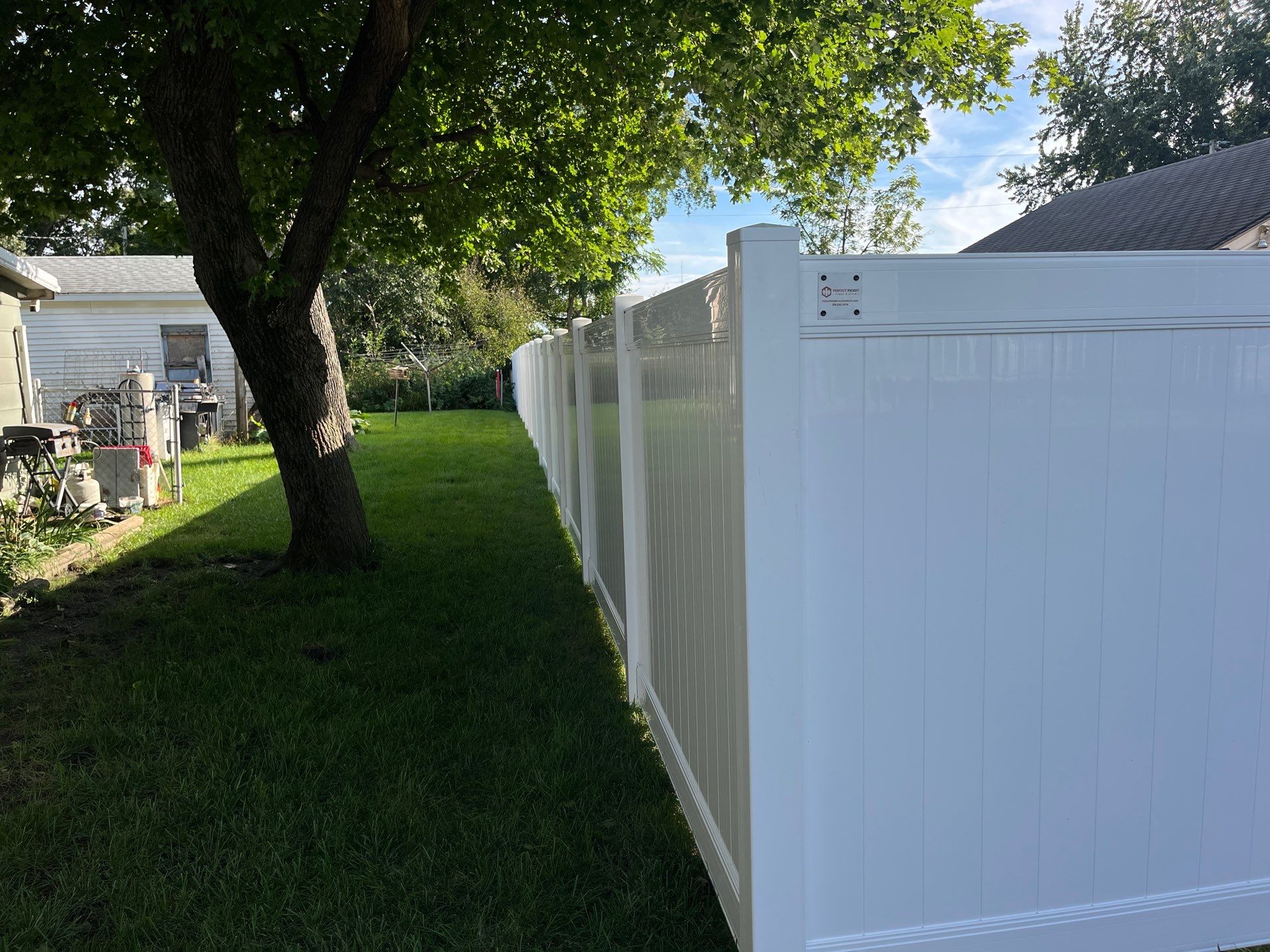 White Vinyl Privacy Fence and Black Chain Link Installation in Sumner by Perfect Picket Fence and Stain