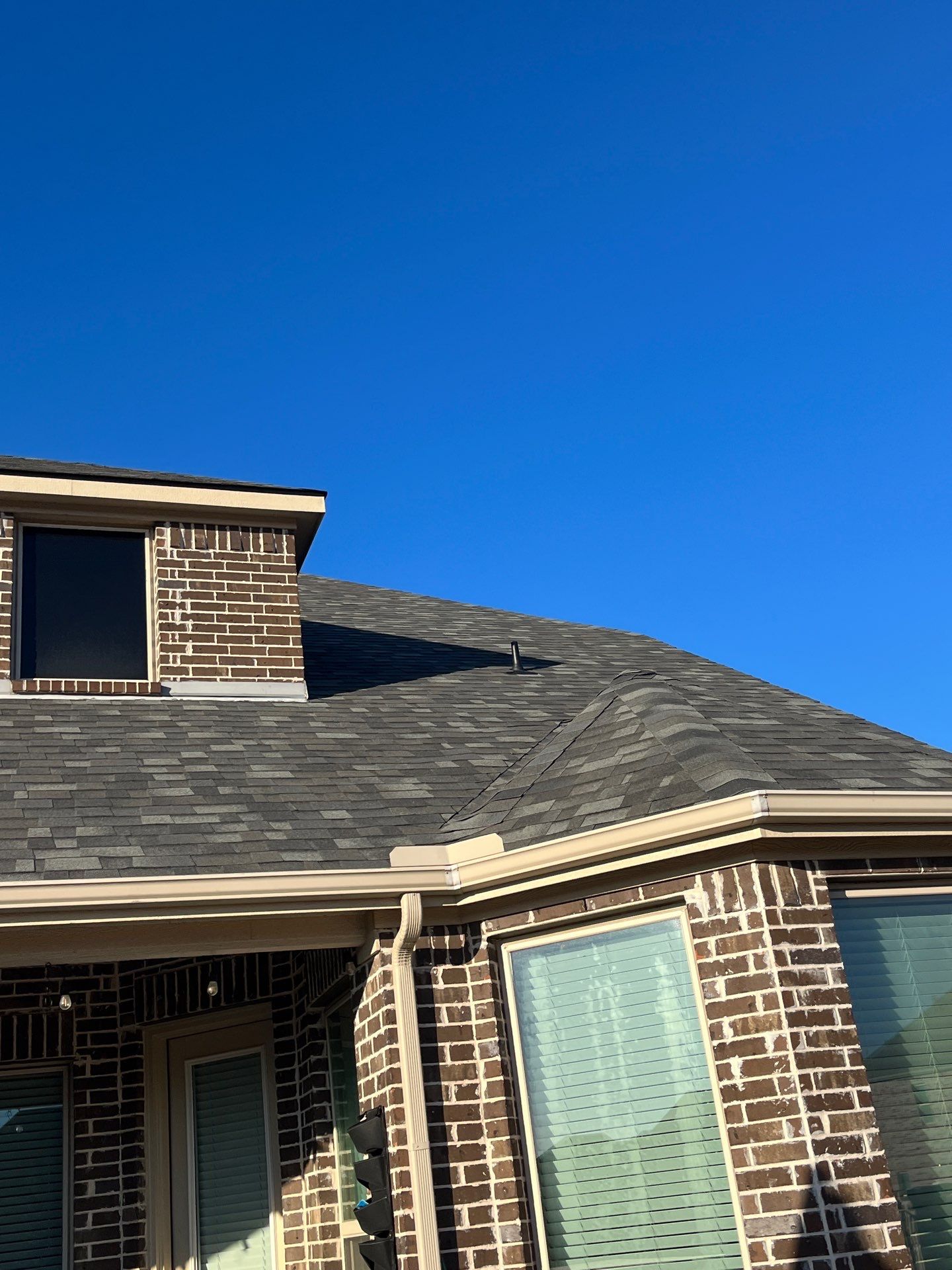 Red Brick with Malarkey Storm Grey by Tejas Roofworks + Restoration