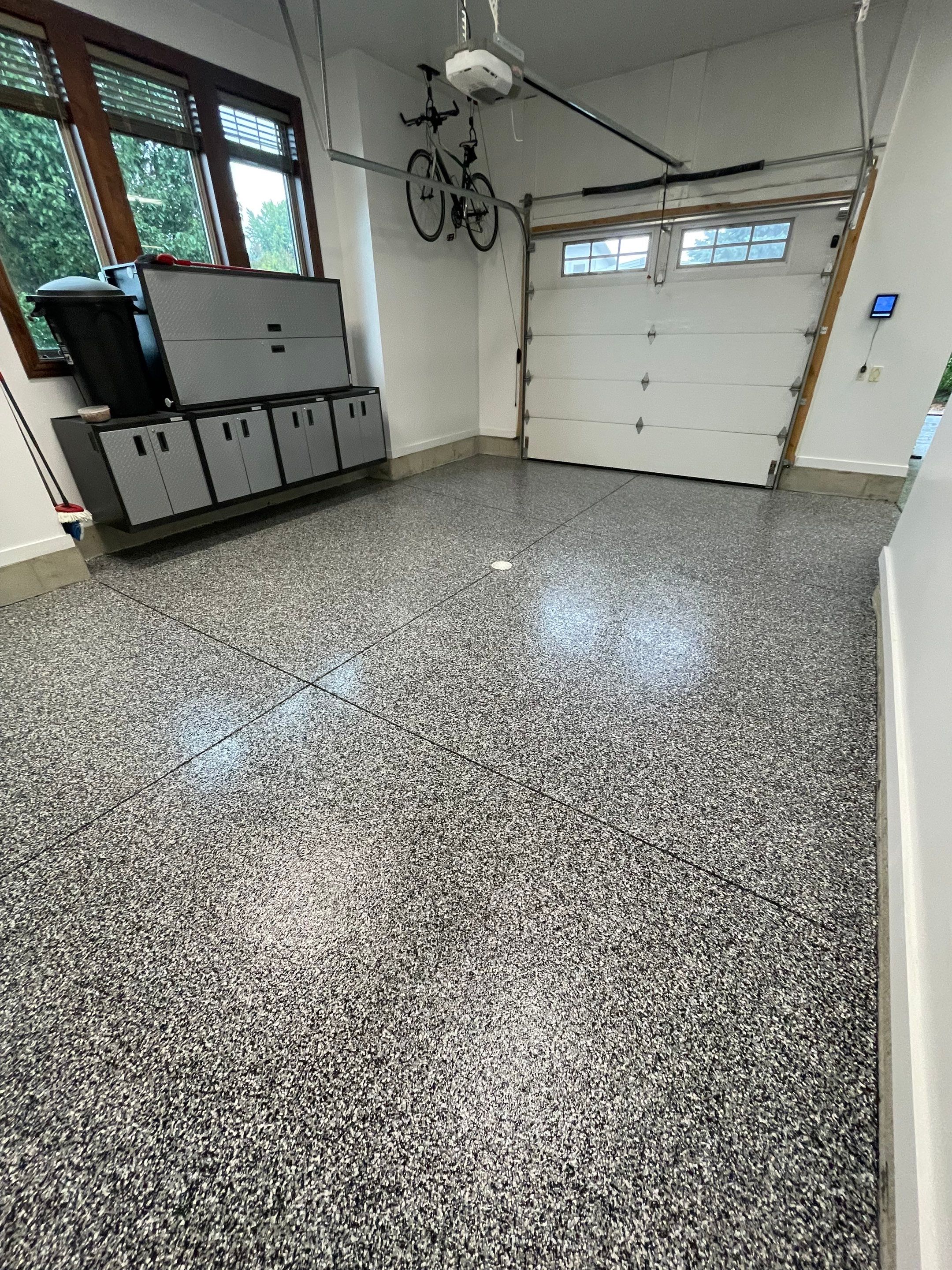 Garage Floor Coating and Domino Flake Finish in Sioux Falls by Select Painting, Coatings & Garage Cabinets
