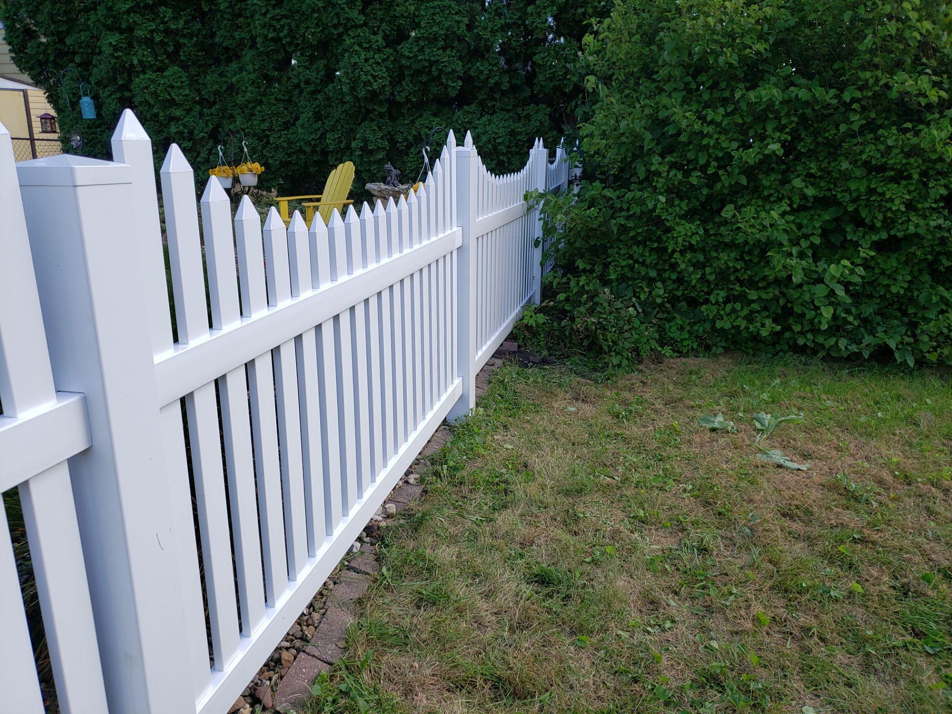 White Vinyl Spaced Picket Fence Installation in Waterloo by Perfect Picket Fence and Stain