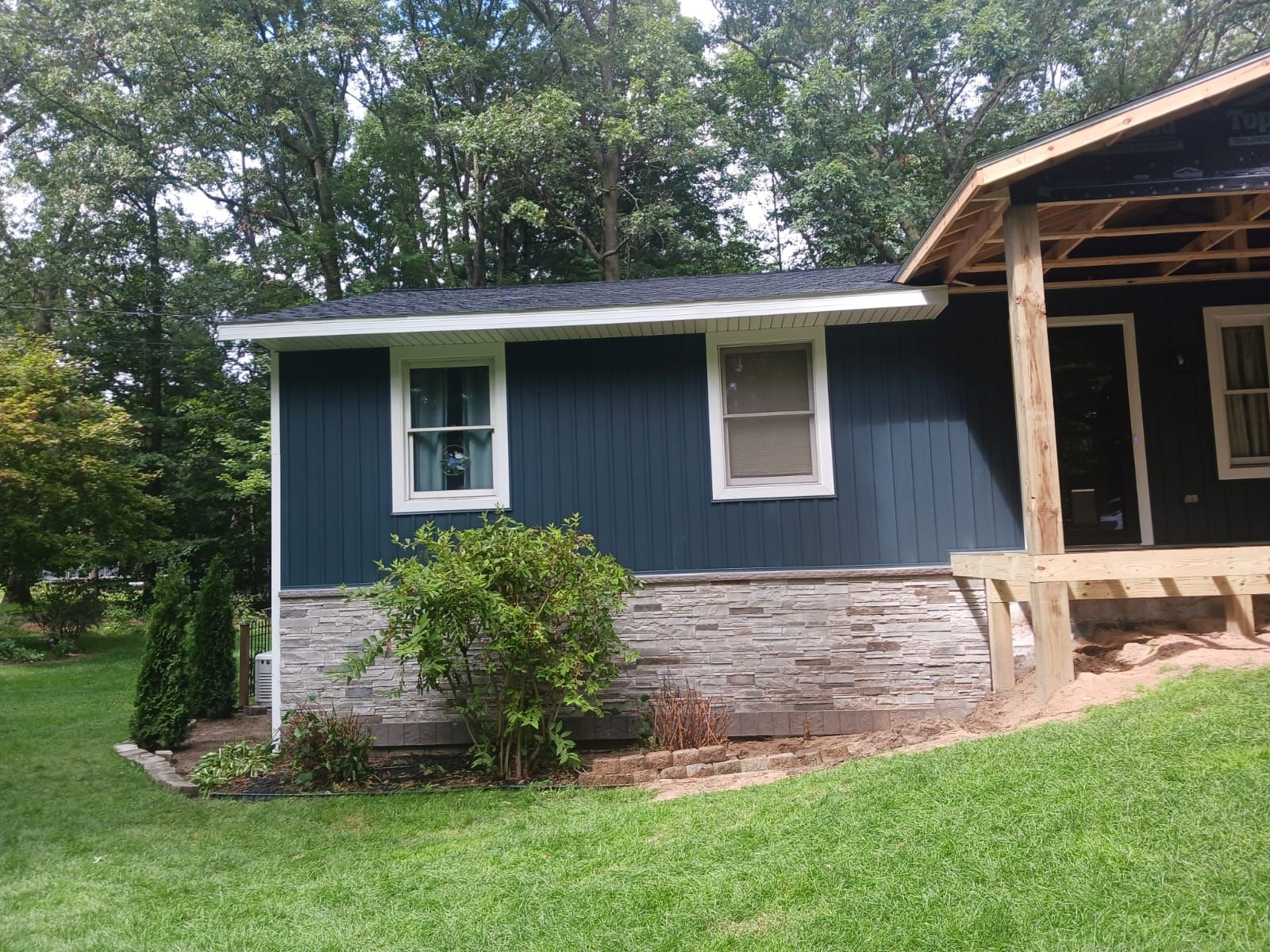 Siding, Deck and Versetta Stone by Avalon Roofing and Exteriors