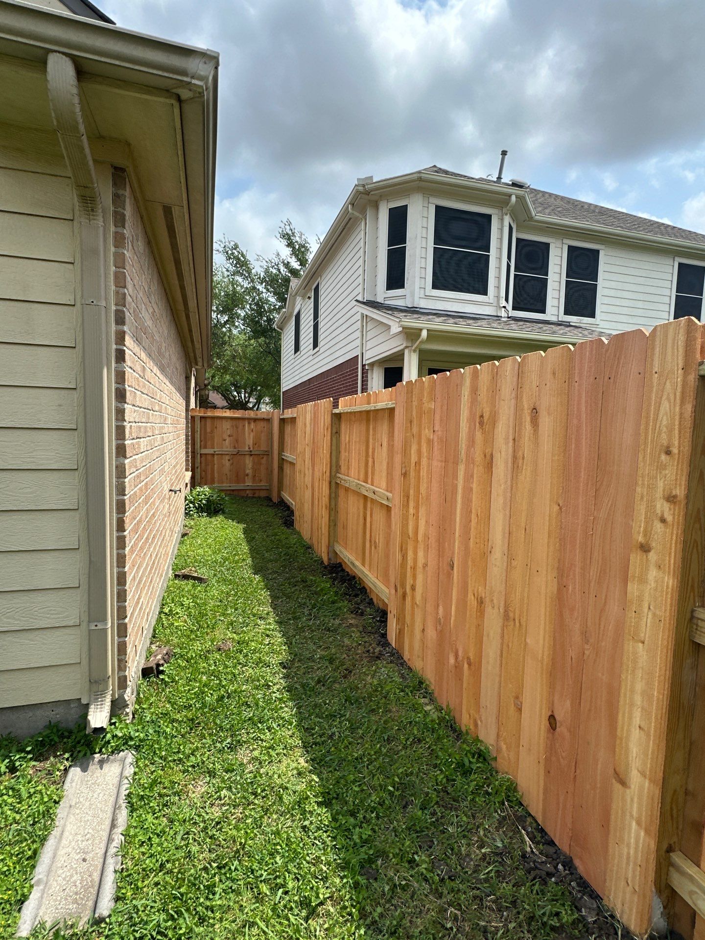Wood fence with alternating panels by Tim's Fences