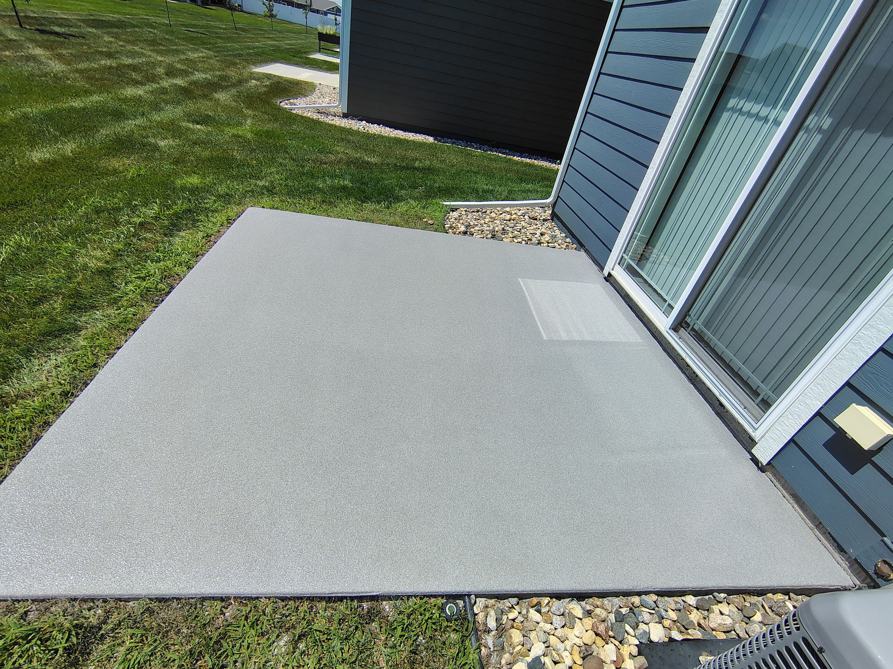 Custom Epoxy Garage Floor and Patio Coating in Sioux Falls by Select Painting, Coatings & Garage Cabinets