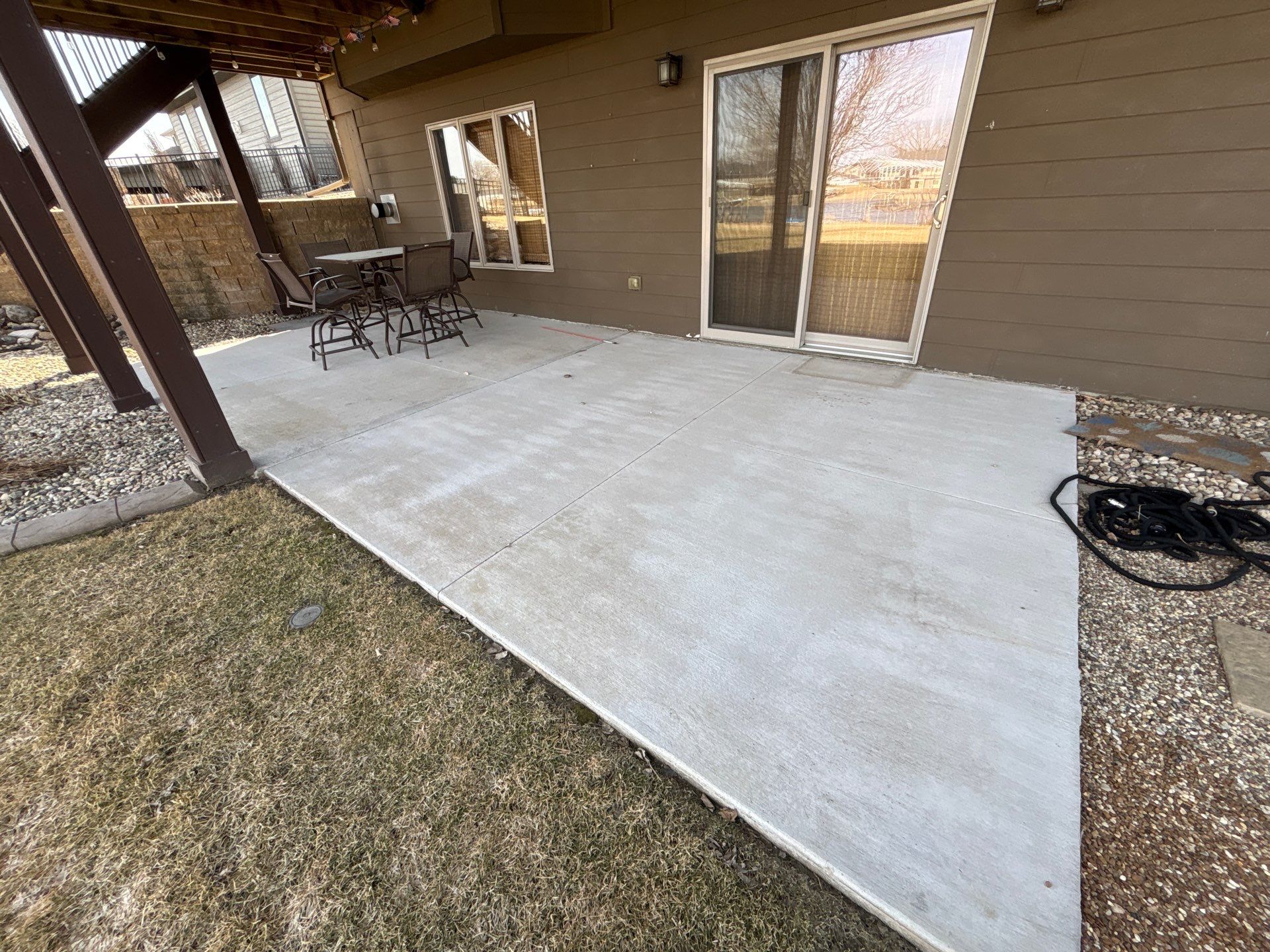 Full Exterior Renovation with Stone Veneer and Composite Decking by Select Painting, Coatings & Garage Cabinets