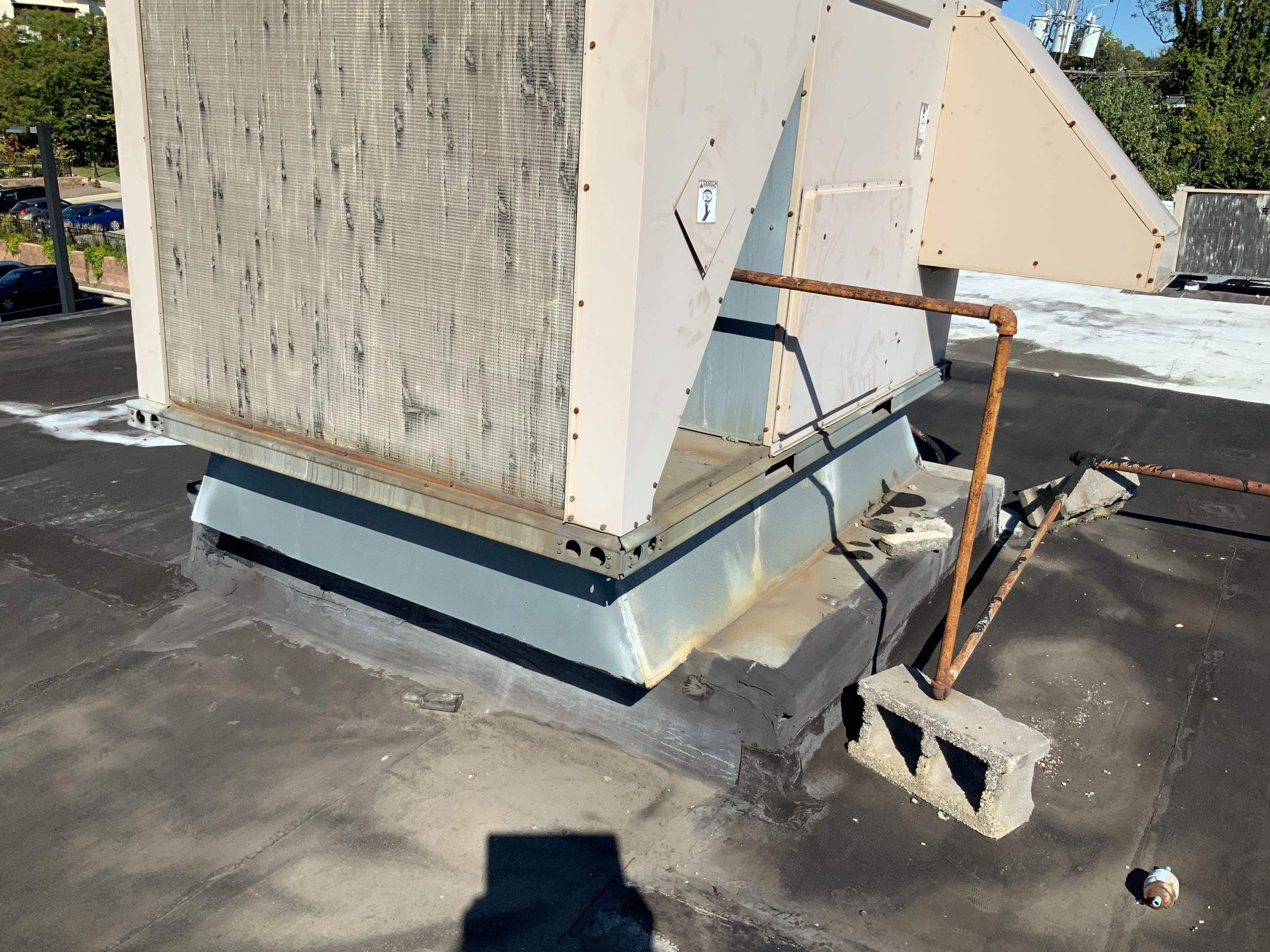 Commercial Roofing Repair using new Flashing by Alpha Design Services