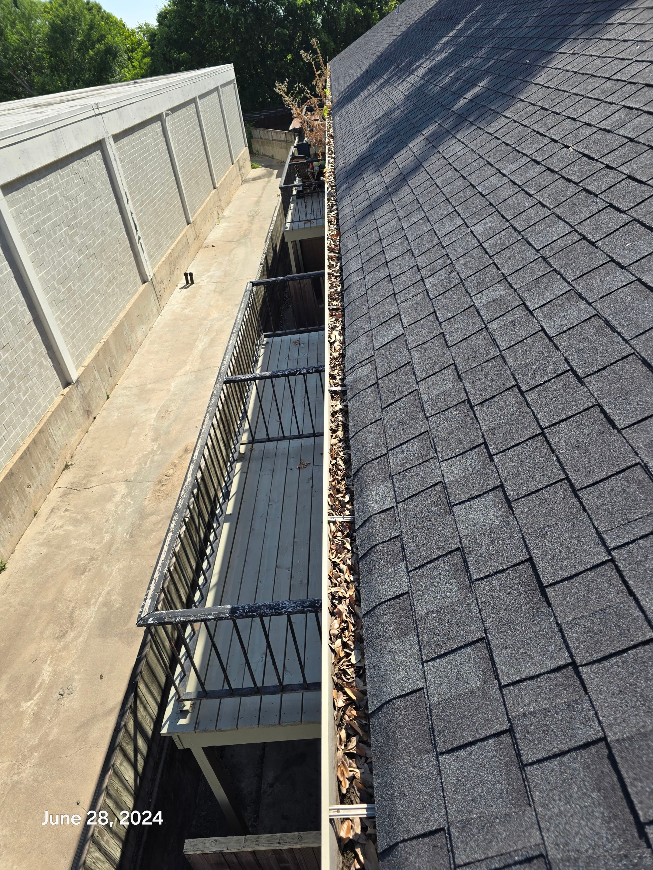 Commercial gutter cleaning Waco, TX before photo with filled gutters