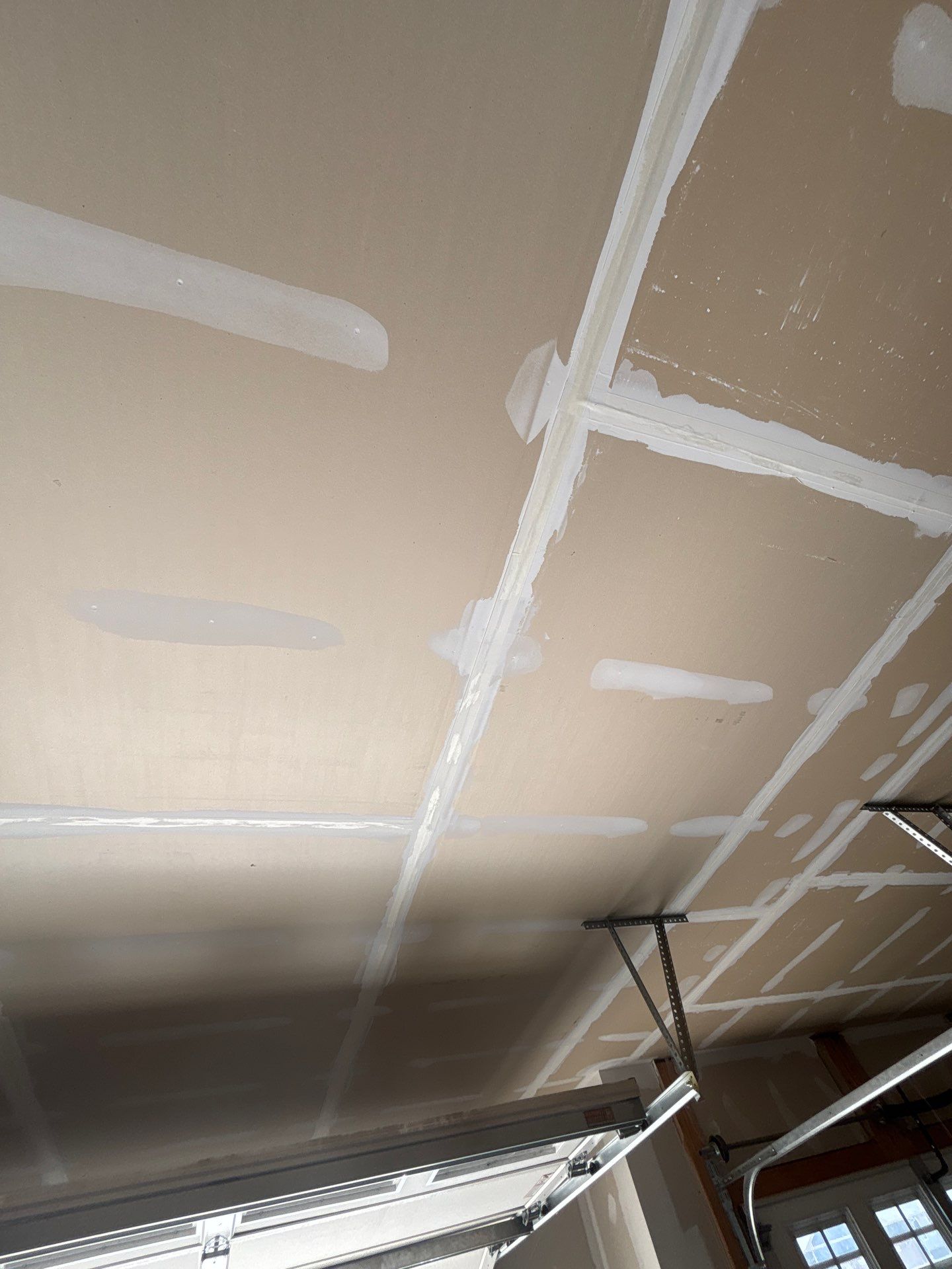 Grey Flake Epoxy Garage Floor Coating in Sioux Falls by Select Painting, Coatings & Garage Cabinets