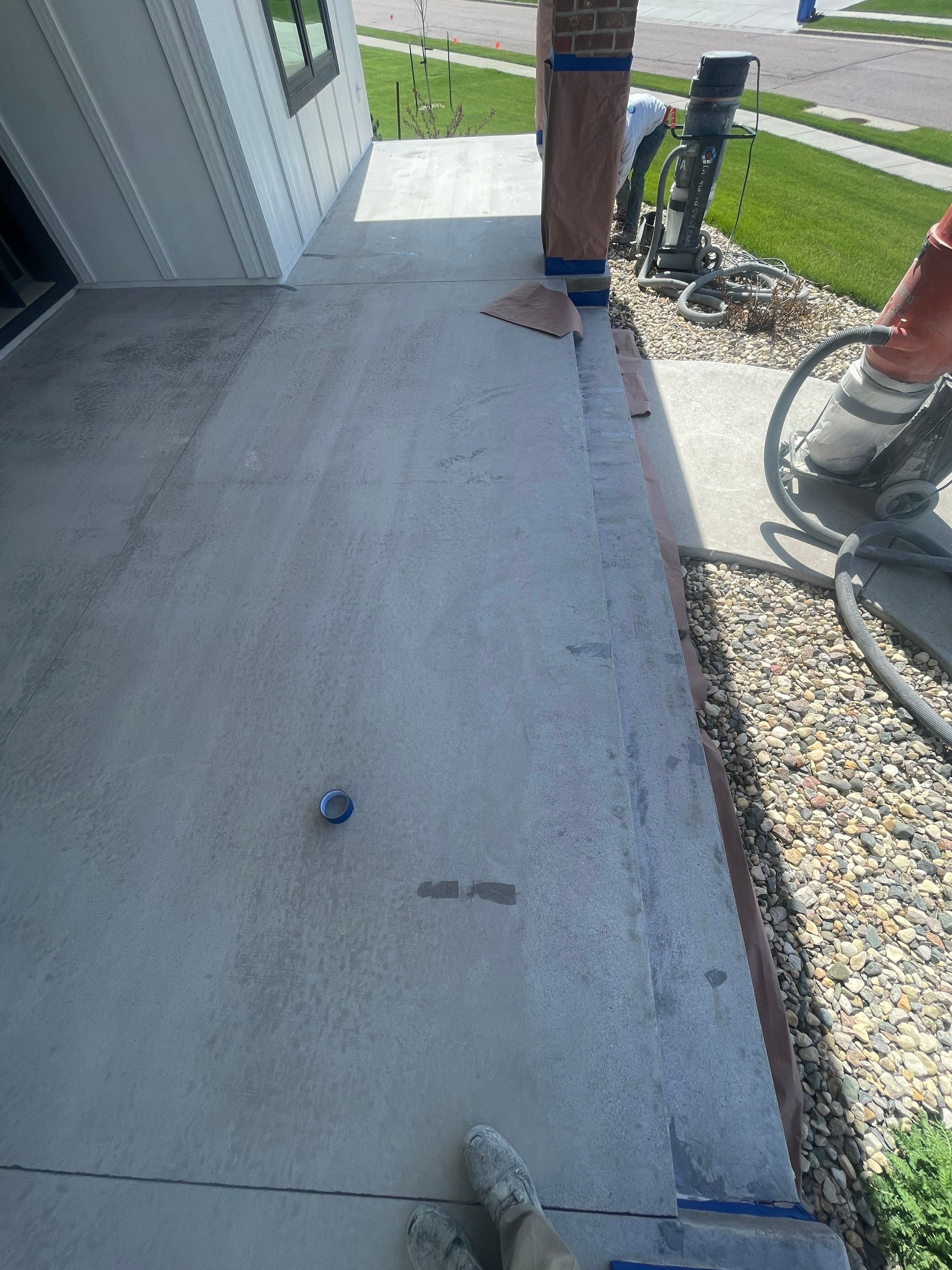 Grey Speckled Concrete Porch Coating for Sioux Falls Home by Select Painting, Coatings & Garage Cabinets