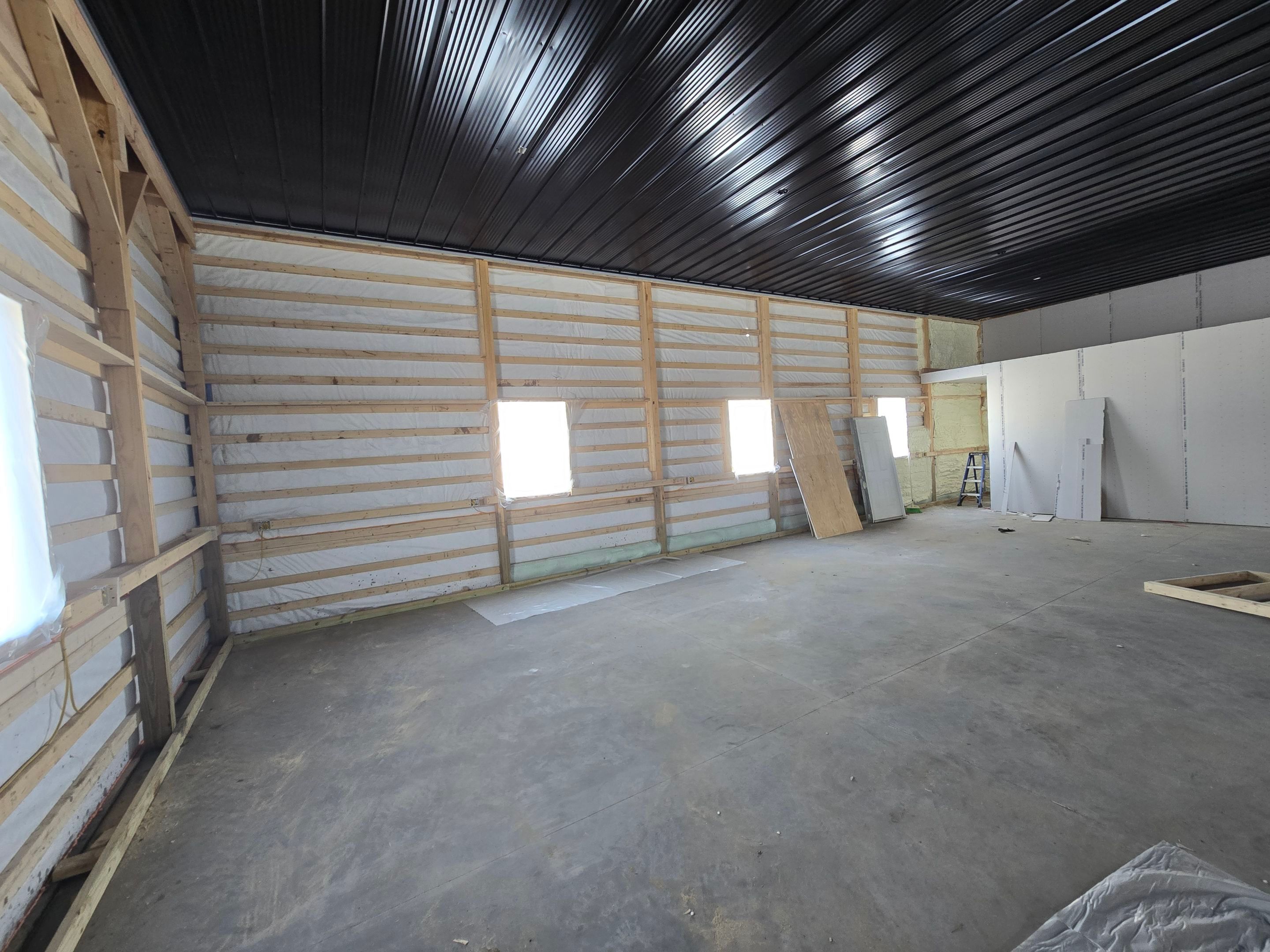 Barndominium  using Textured Board & Batton by Horst Custom Homes 