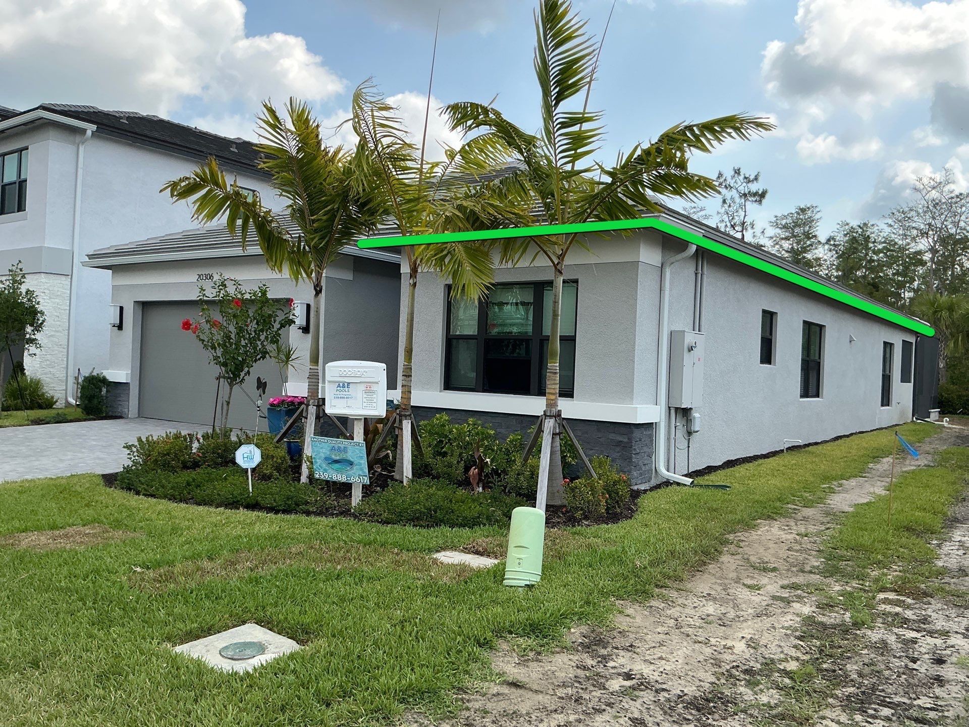 Grey Seamless Gutter Installation in Estero FL by Gutter Professors