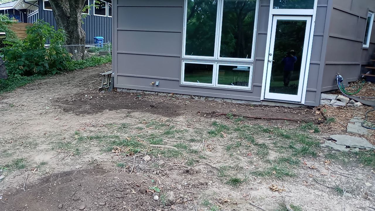 Back Yard Cantilivered Patio by LAND ESCAPES LLC