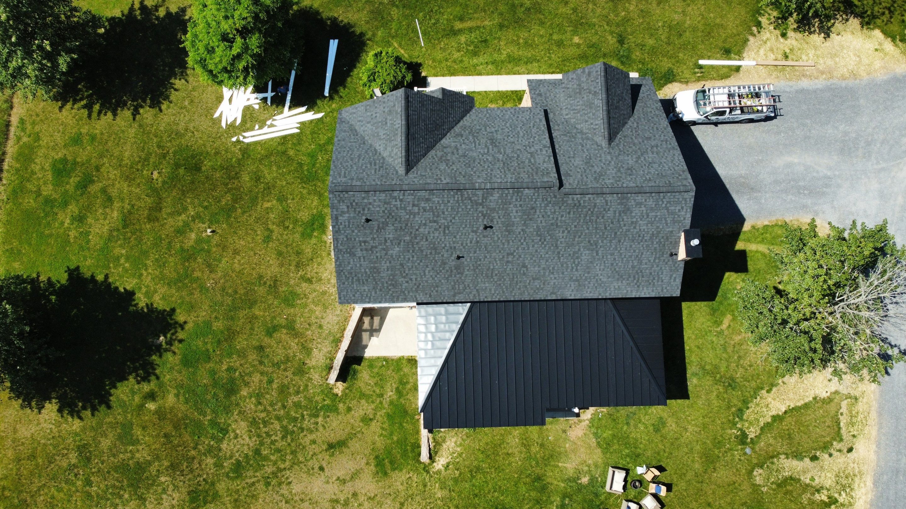 Roof Damage using Certainteed Lifetime Roofing System- Moire Black Landmark Pro shingkes with shadow ridge caps. by BulletpROOF Exteriors