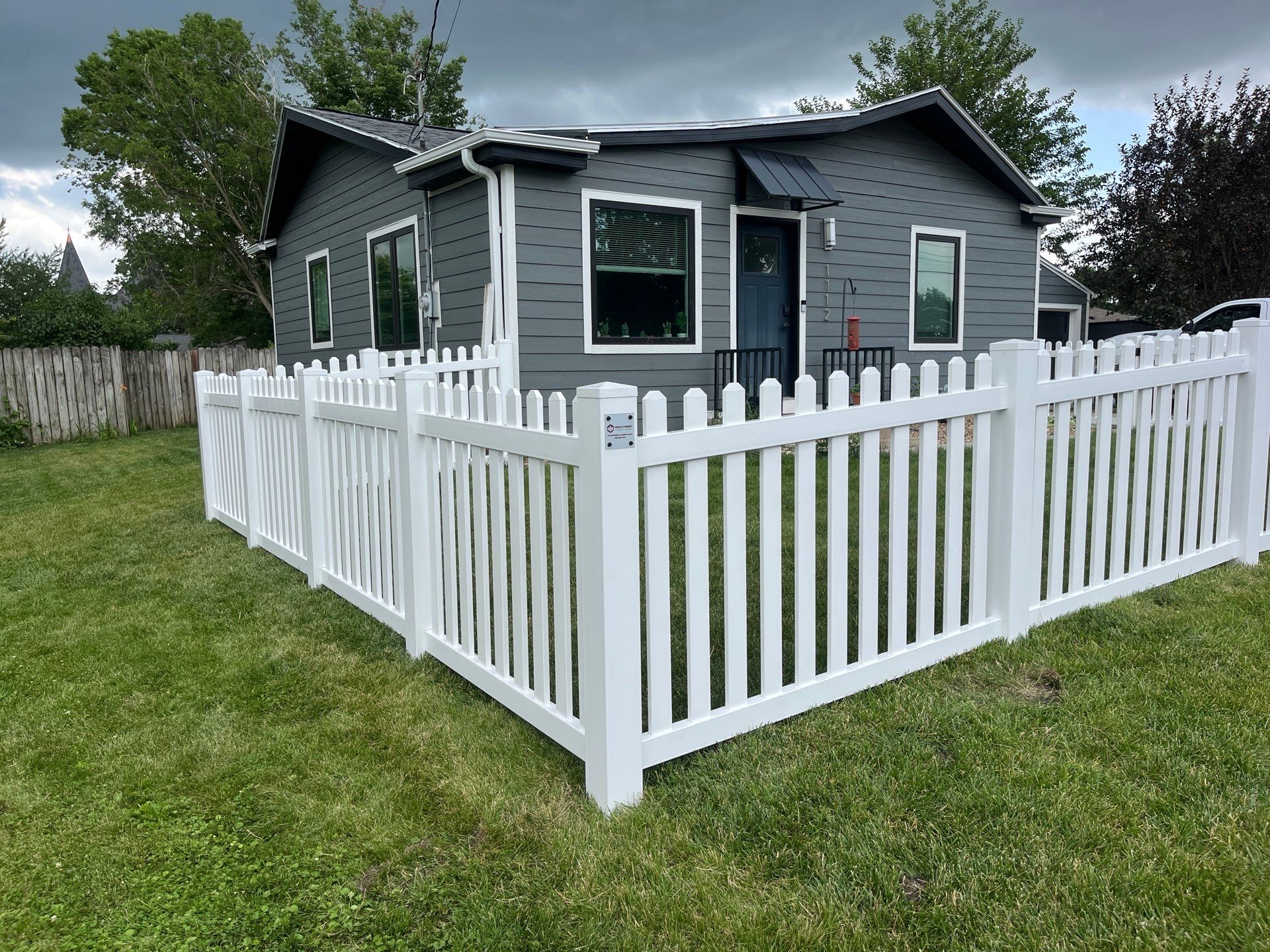 White Vinyl Spaced Picket Fence Installation in Cedar Falls by Perfect Picket Fence and Stain