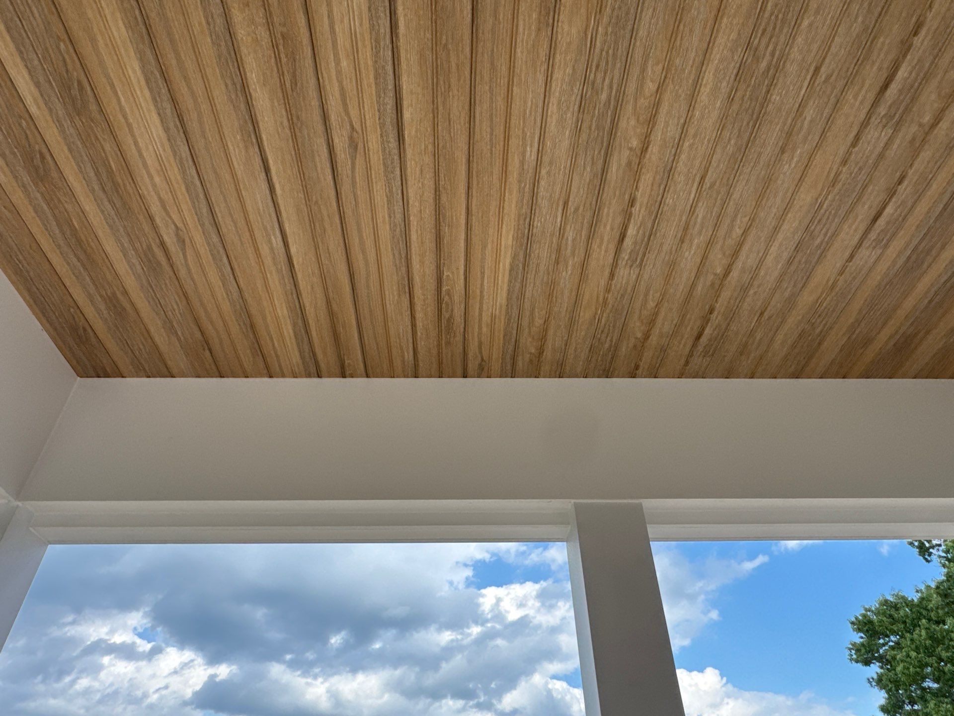 Two-Story Custom Home With Board and Batten Siding by Cade Construction