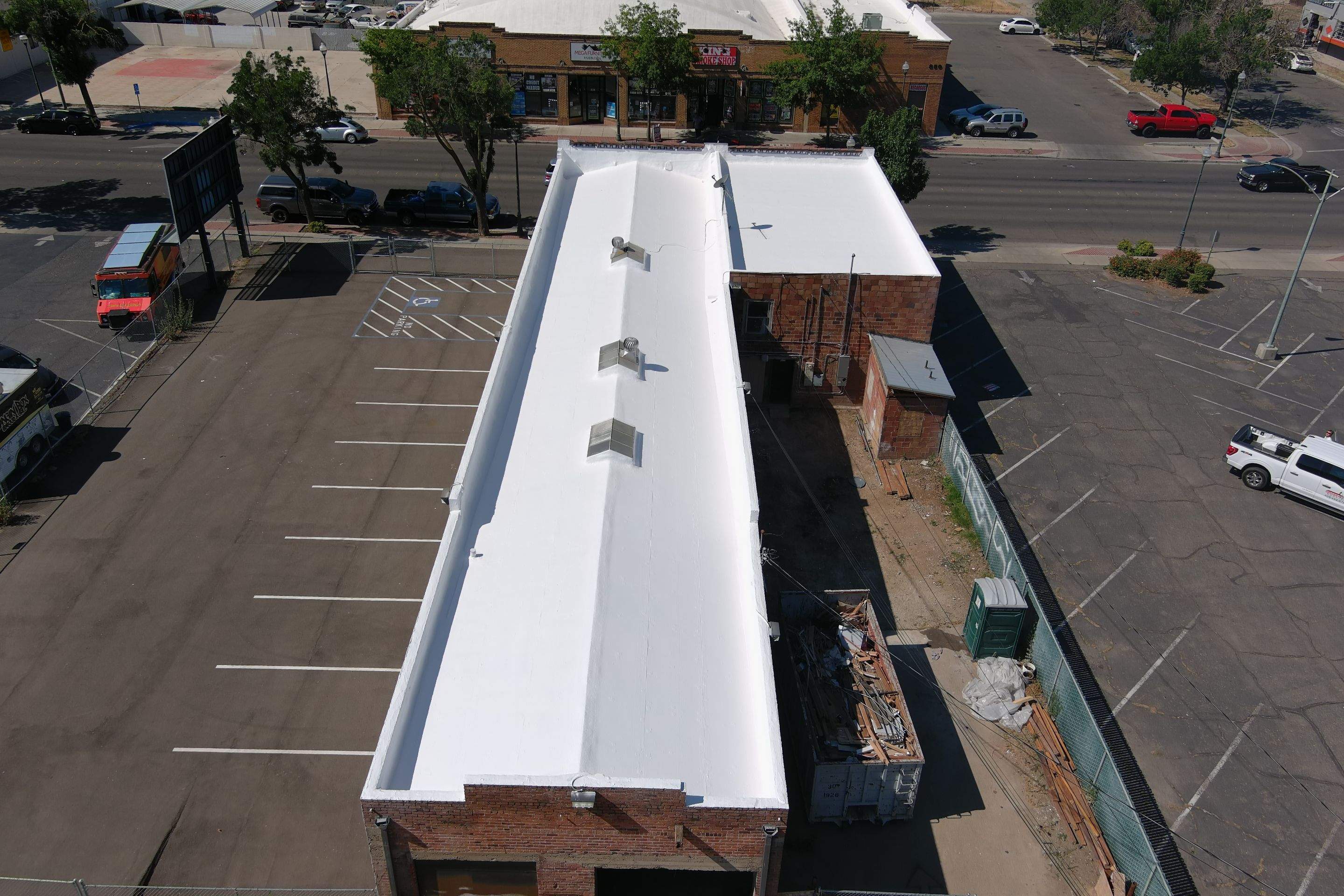 Commercial Roofing Installation using Conklin BenchPly system with PUMA top coat (imbedded fabric system) by Straight Edge Roofing Inc
