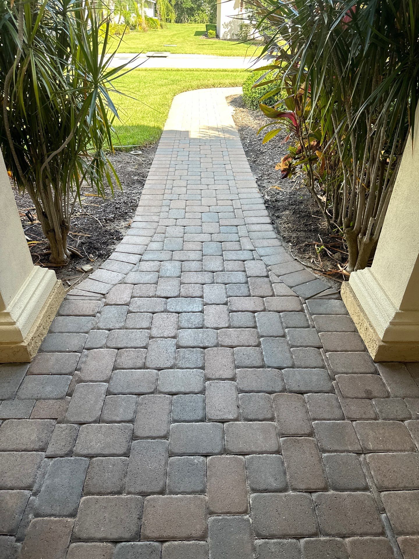 Paver Driveway, Entryway, Sidewalk, and Street Curbing Cleaning in Winding River Community, Bradenton, FL by Sunshine AquaWash