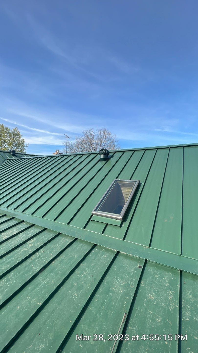 Shingle to Standing Seam Metal Roof by Springtree Restoration 