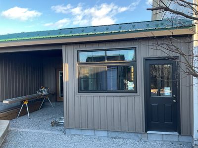 Multi-Story Residential Addition Featuring Textured Metal Siding in Millersburg