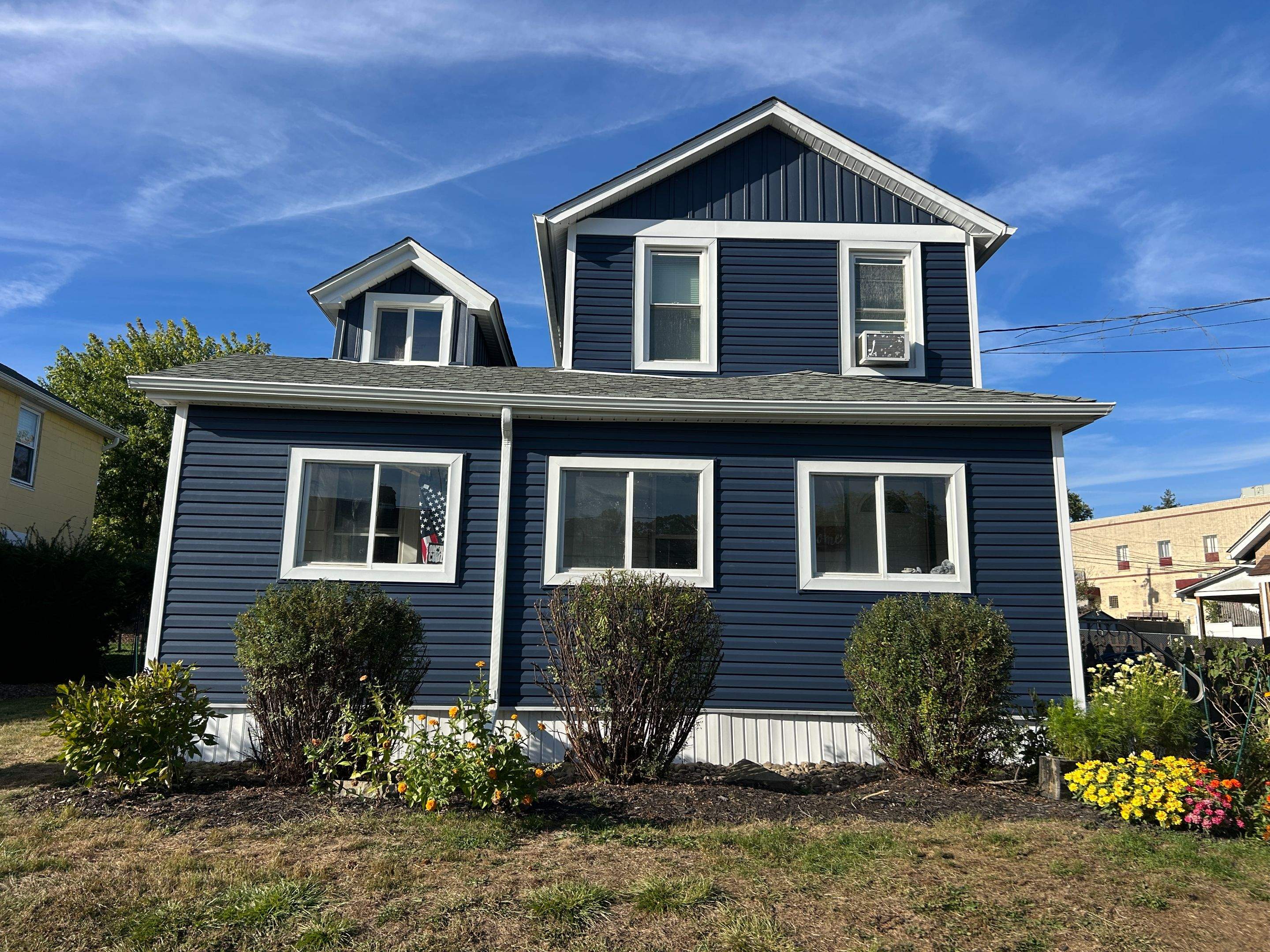 House Siding Renovation with White Vinyl in Bridgeville by Ideal Siding Pittsburgh