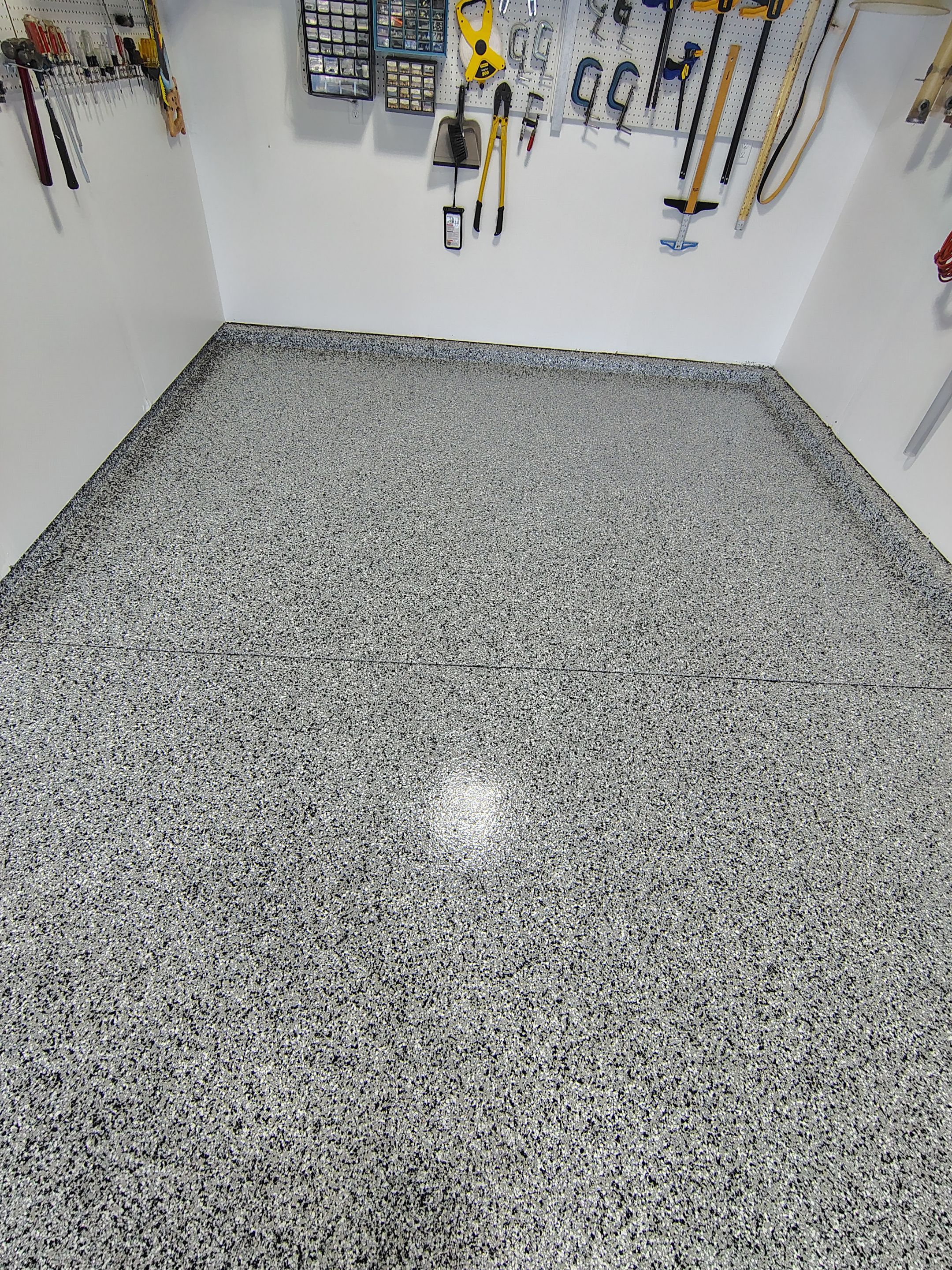 Decorative Flake Garage Floor Coating Installation in Tea, South Dakota by Select Painting, Coatings & Garage Cabinets