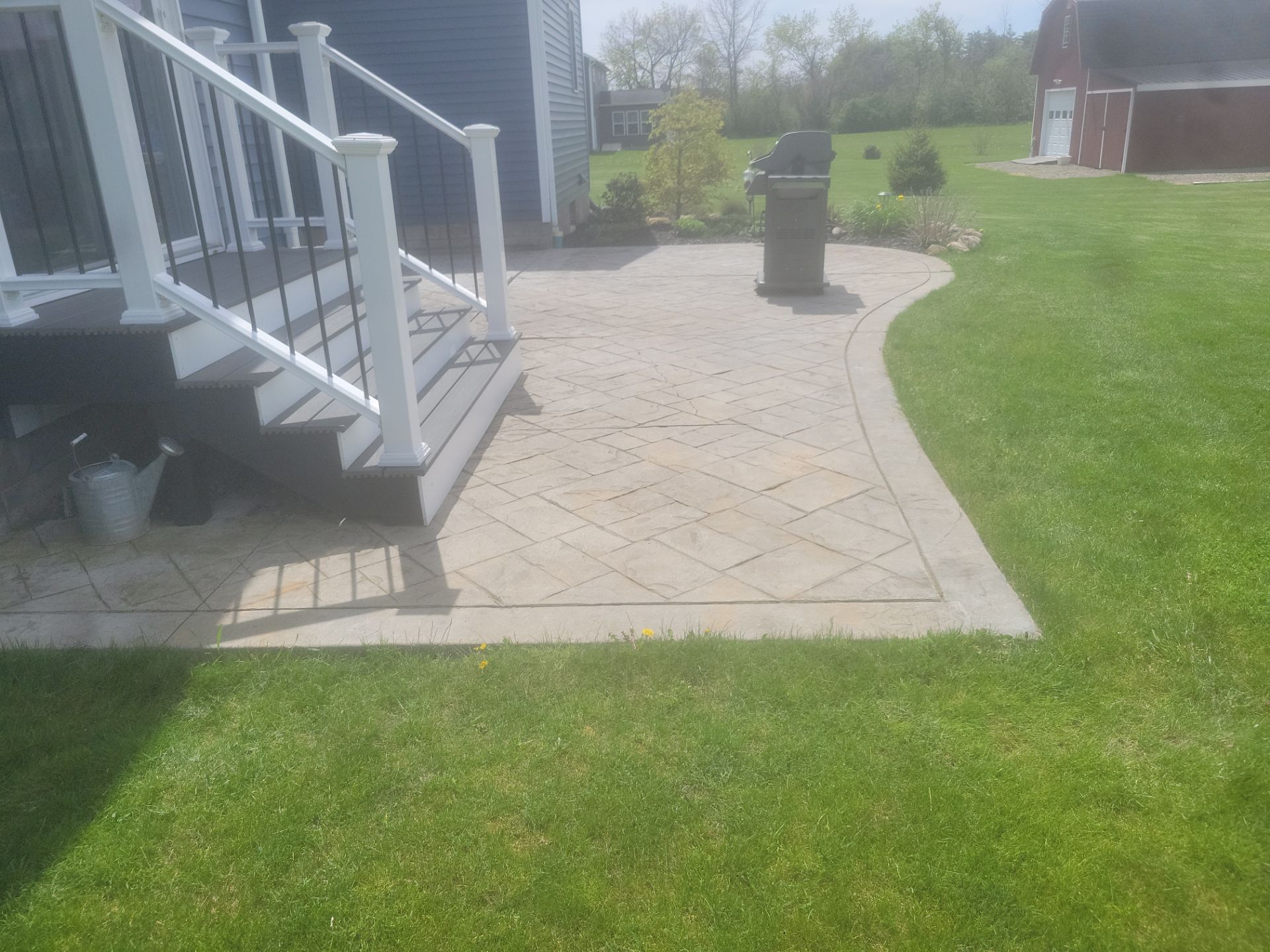 Slate stamped concrete patio  by NG Masonry & Construction LLC