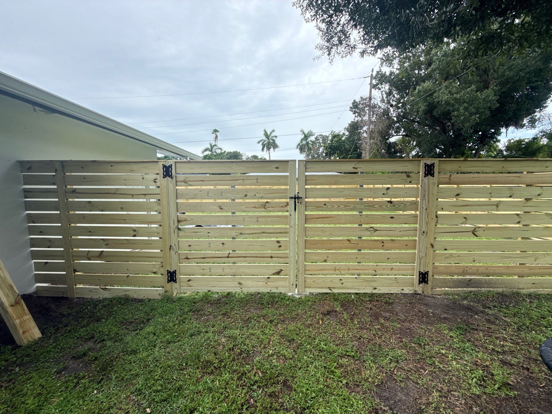 Modern Horizontal Wood Privacy Fence Installation in Fort Myers by True Fence LLC