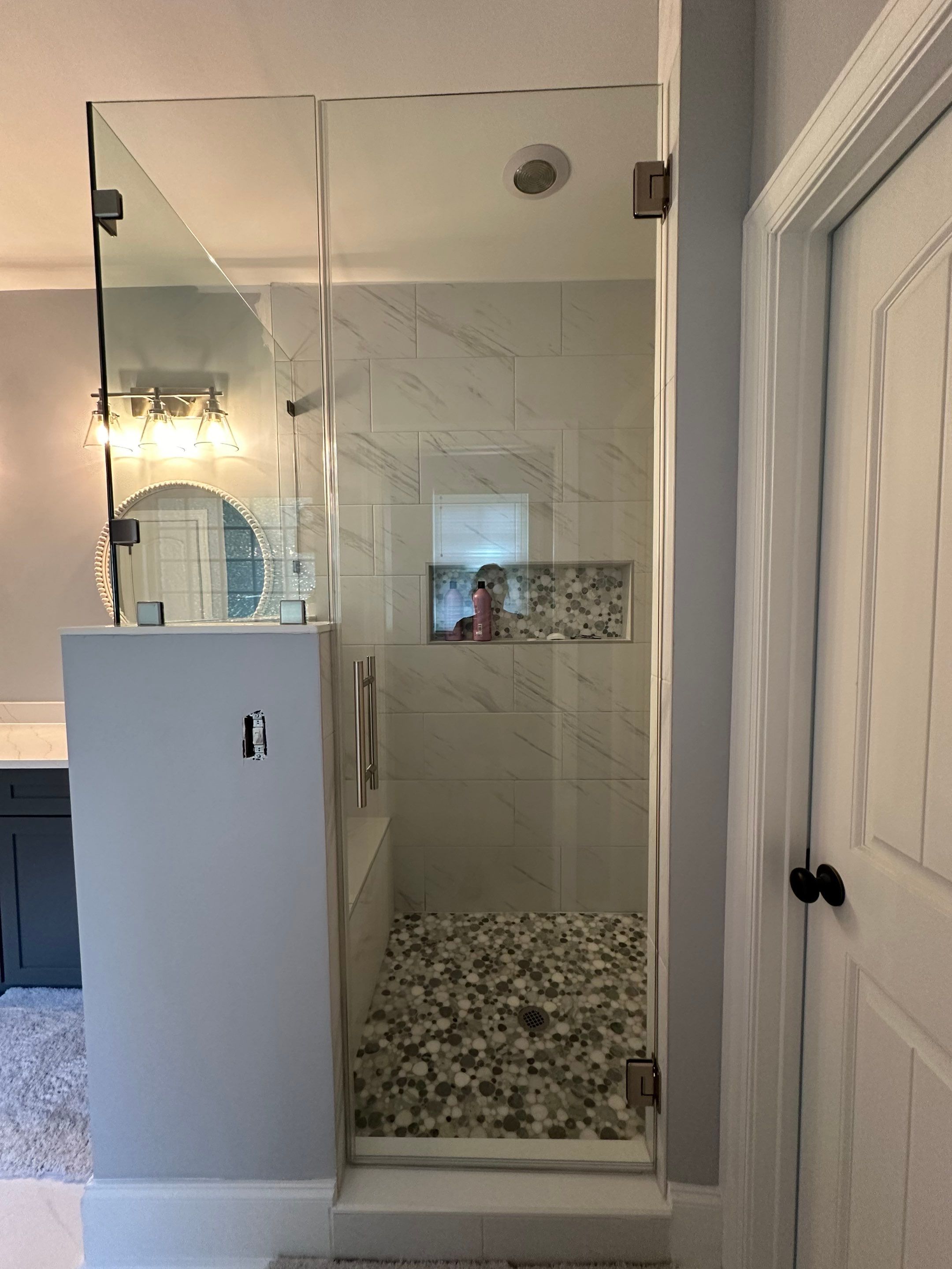 Bright Bathroom Remodel with Wall Removal, Stand Alone Tub and New Vanity by Footprints Floors of Coastal Carolina