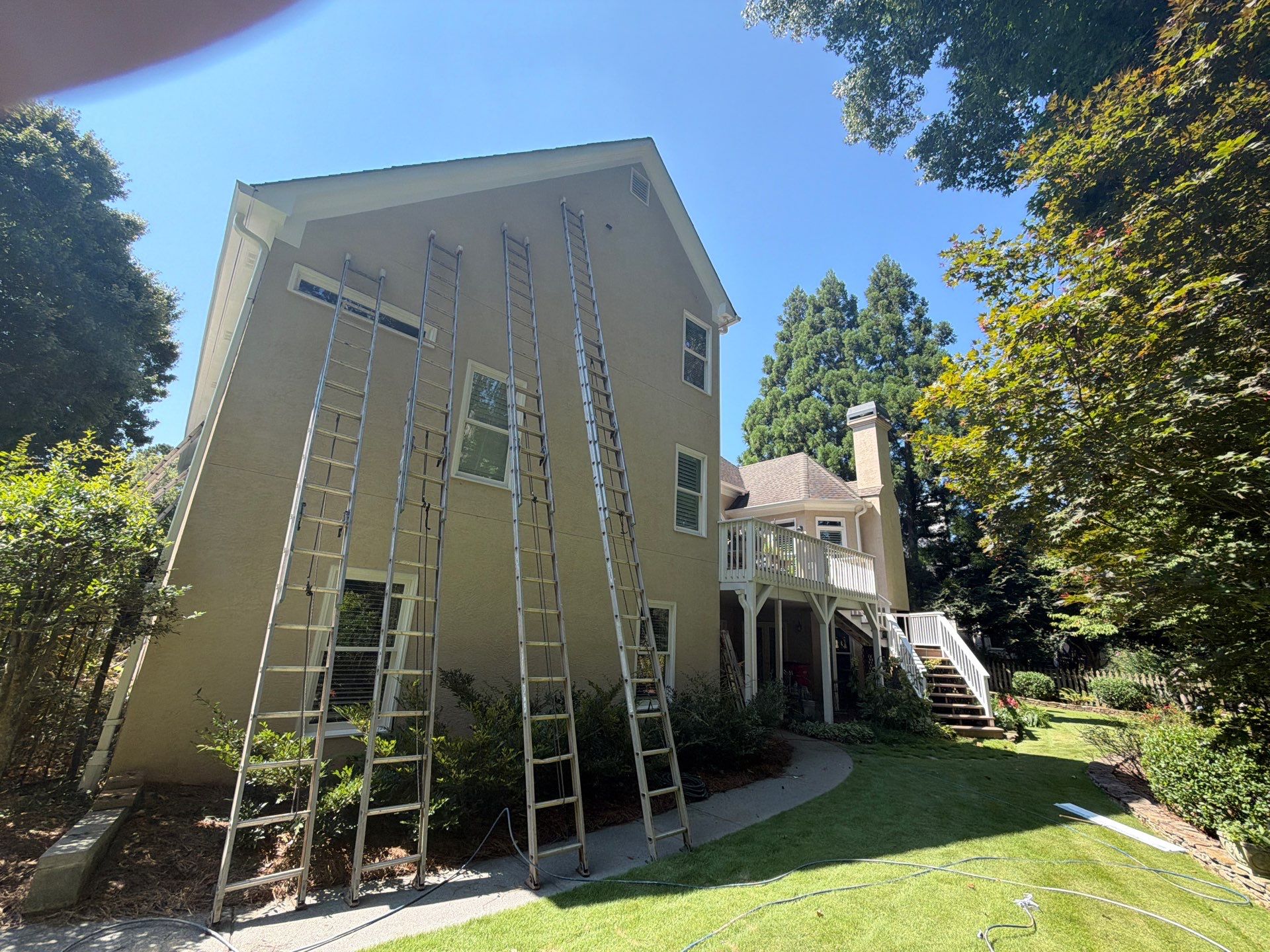Multi-Story Stucco Home Exterior Painting and Garage Refresh in Marietta by Swift Home Renovations 