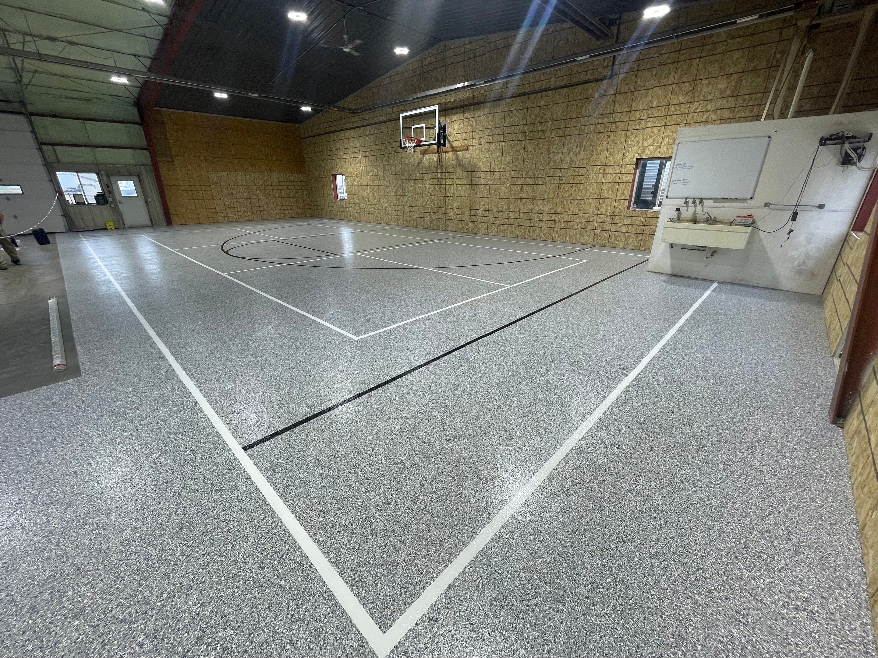 Custom Polyurea Shop Floor with Basketball Court Lines in Rock Valley by Select Painting, Coatings & Garage Cabinets