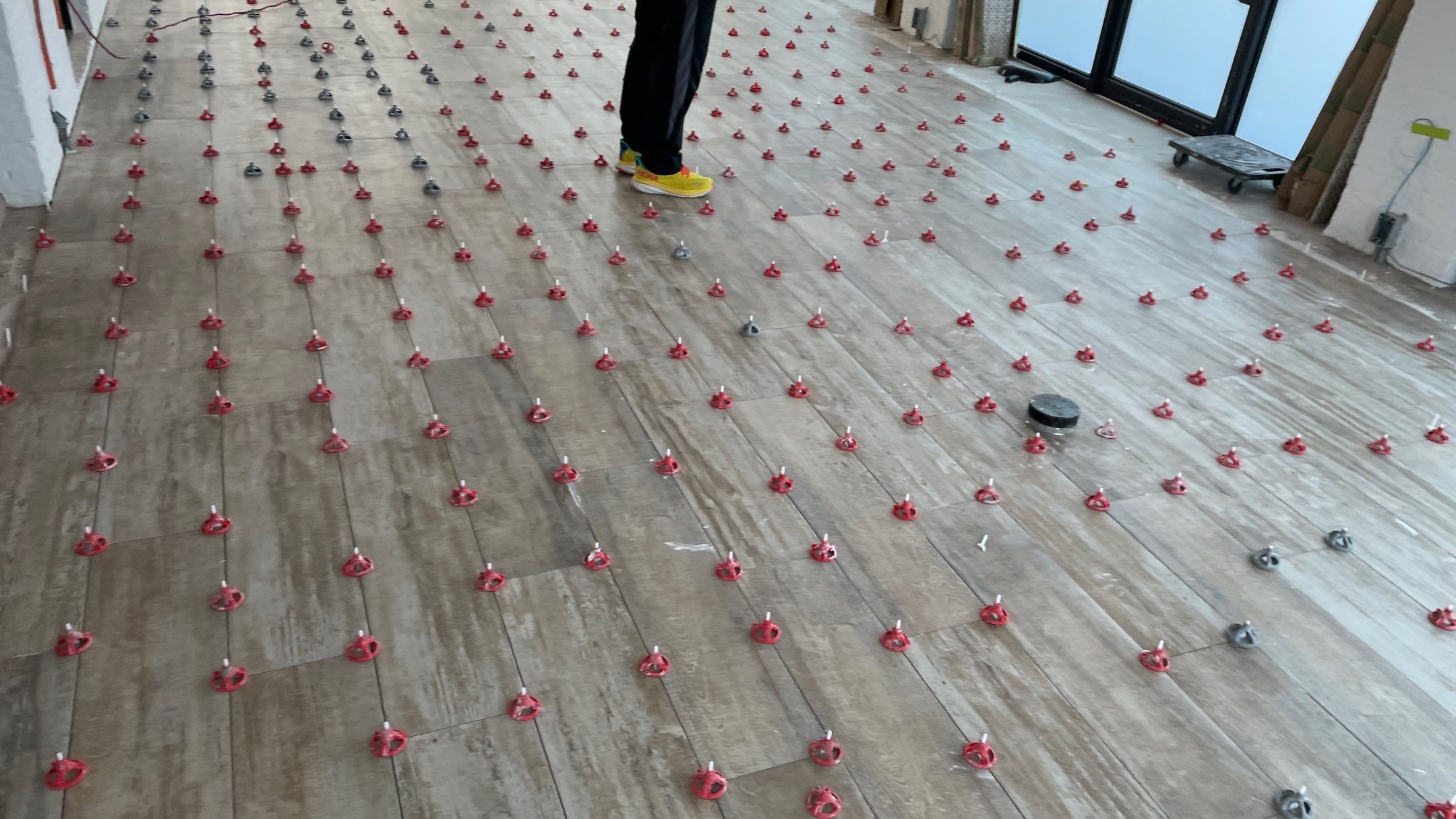 Instant Transformation of this Beautiful Sunroom by Footprints Floors of Coastal Carolina