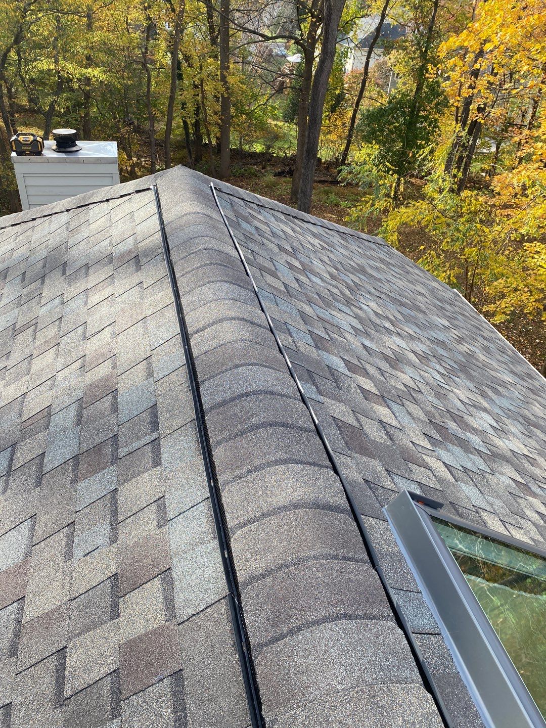 Install new shingles and new skylights  by Alpha Design Services
