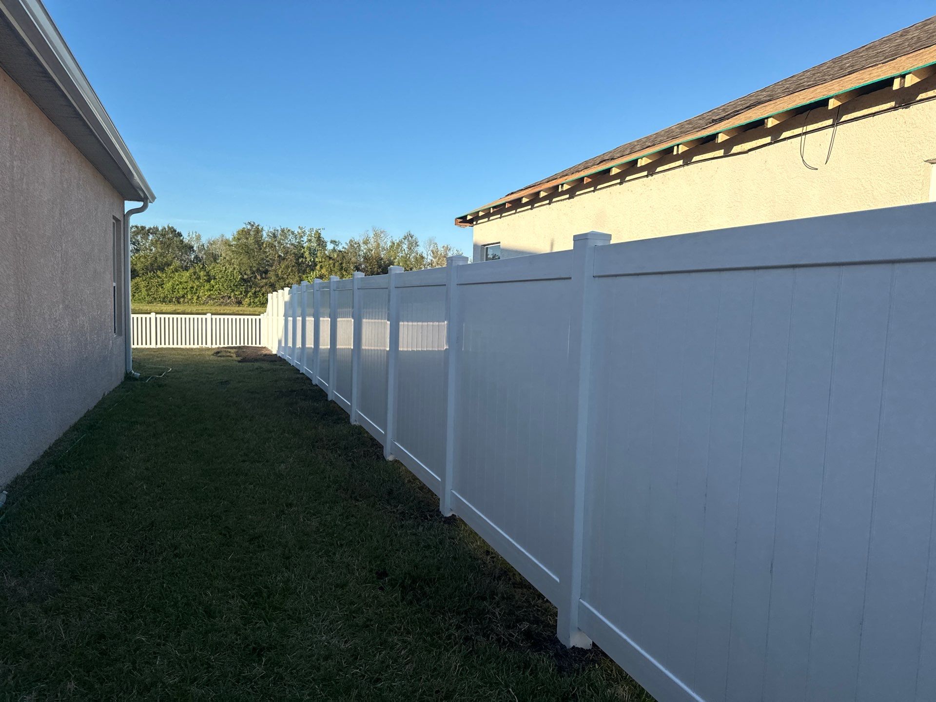 Vinyl Picket Fence Installation using 6Ft White Vinyl Privacy Fence with a 4Ft White Clearwater Picket Fence by Asap fence and gates, LLC