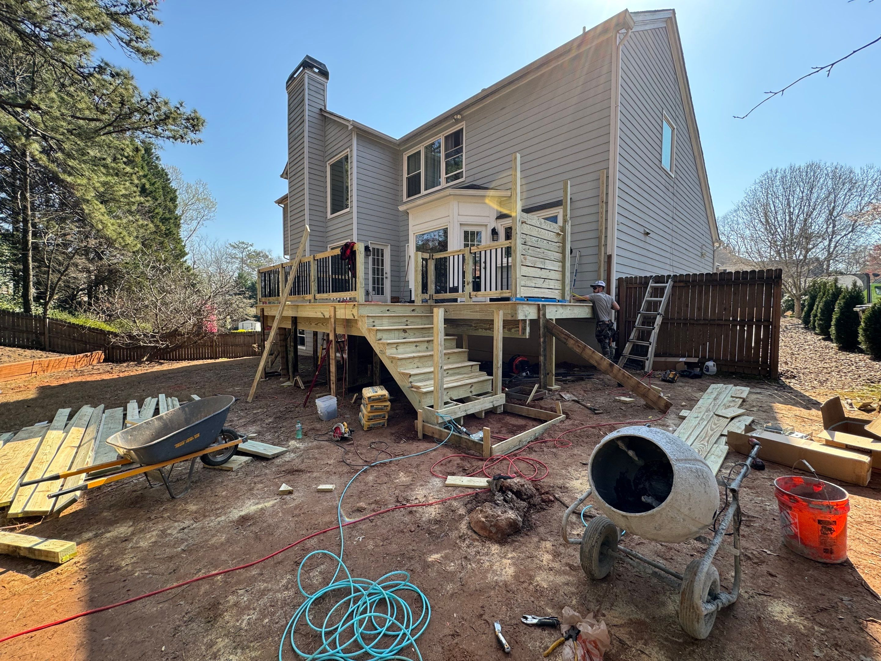 Elevated Deck Replacement with Black Metal Railings in Johns Creek by Swift Home Renovations