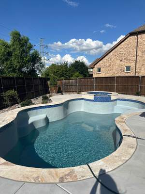 Freeform Pool and Spa with Pergola and Outdoor Kitchen