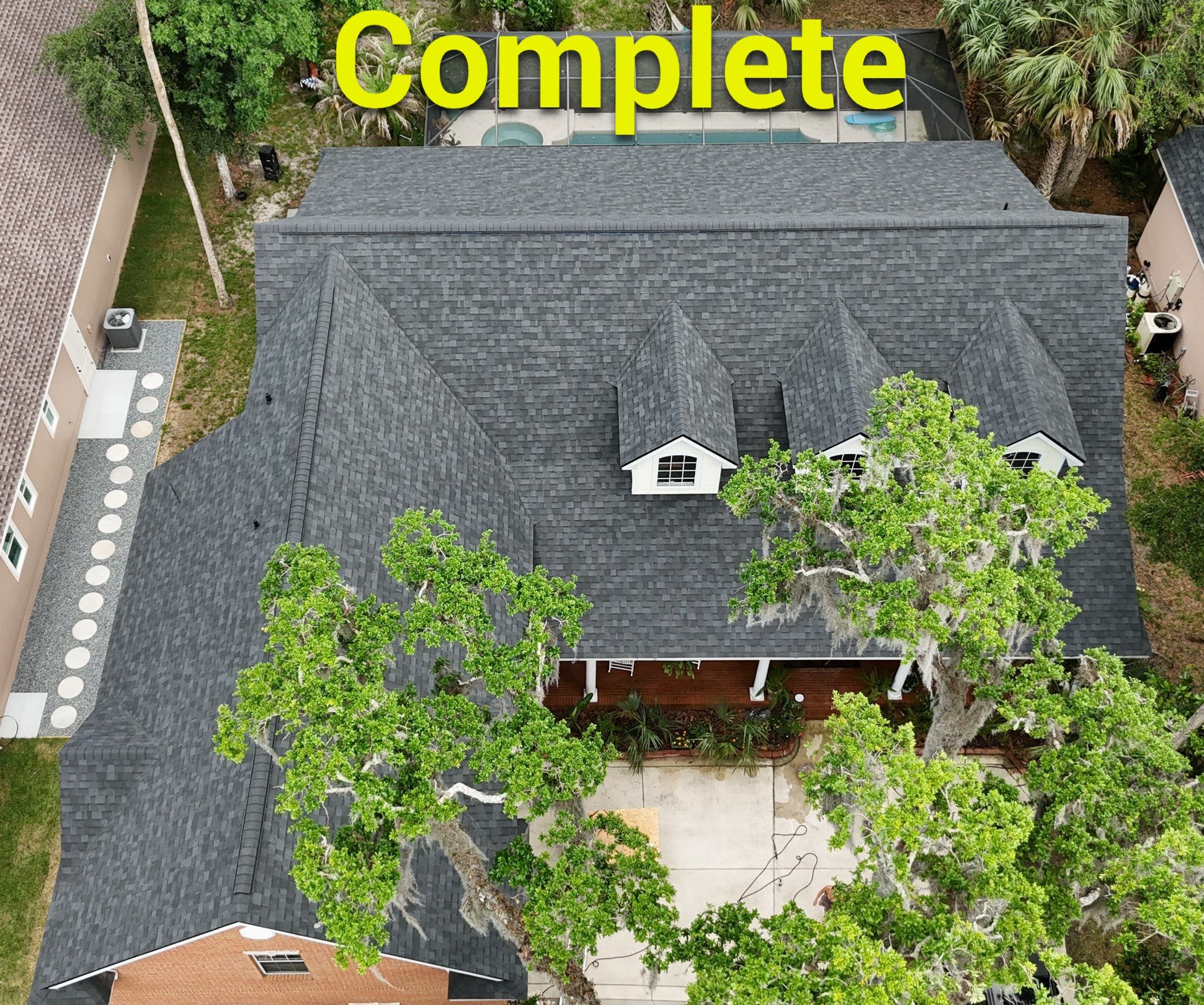 Comprehensive Onyx Black Asphalt Shingle Roof Replacement for Flagler Beach Residence by Trinity Restoration and Roofing LLC