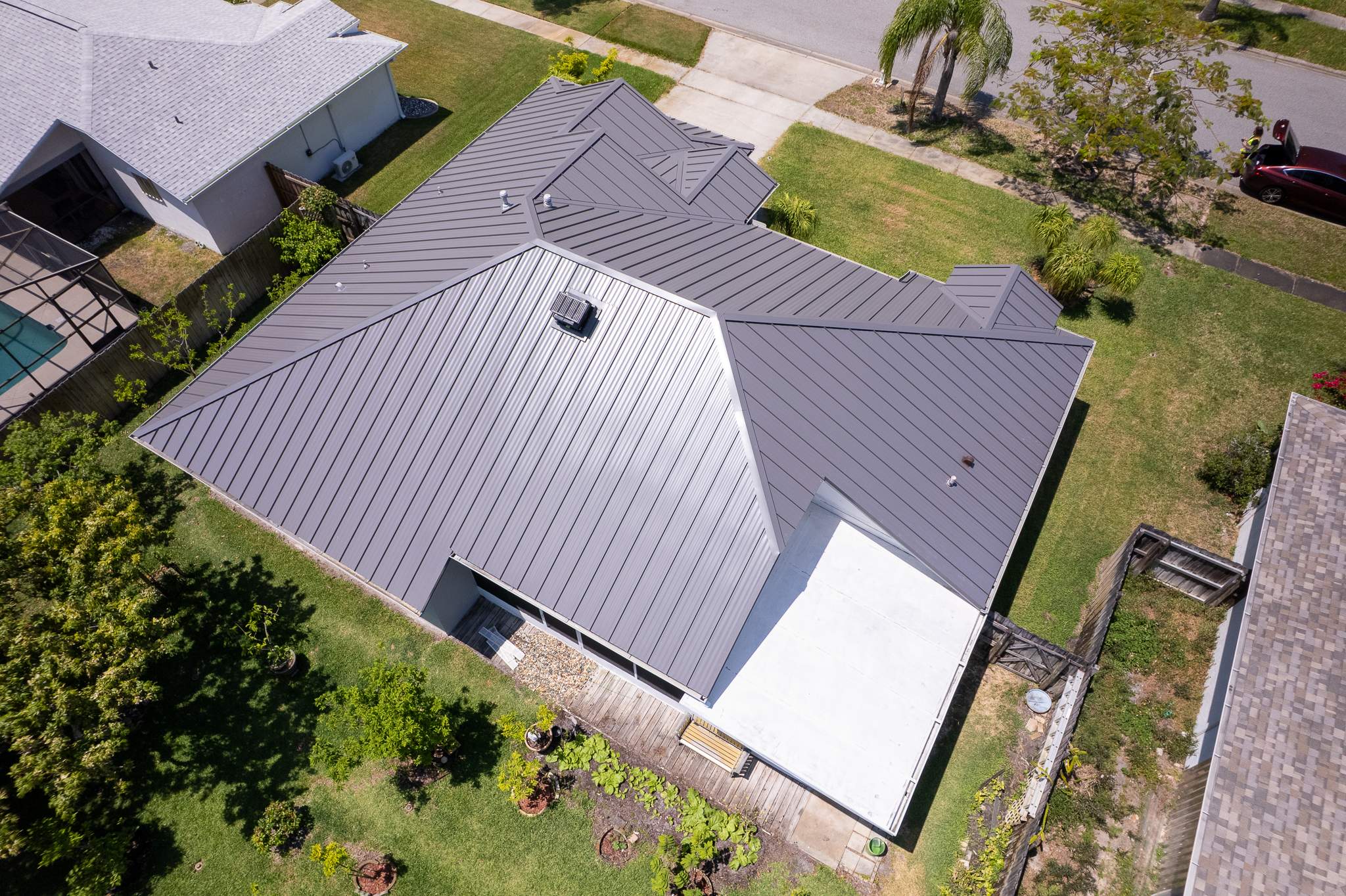 Complete Metal Roof Replacement and Seamless Gutter Installation in Melbourne by Wiedmann Construction & Roofing
