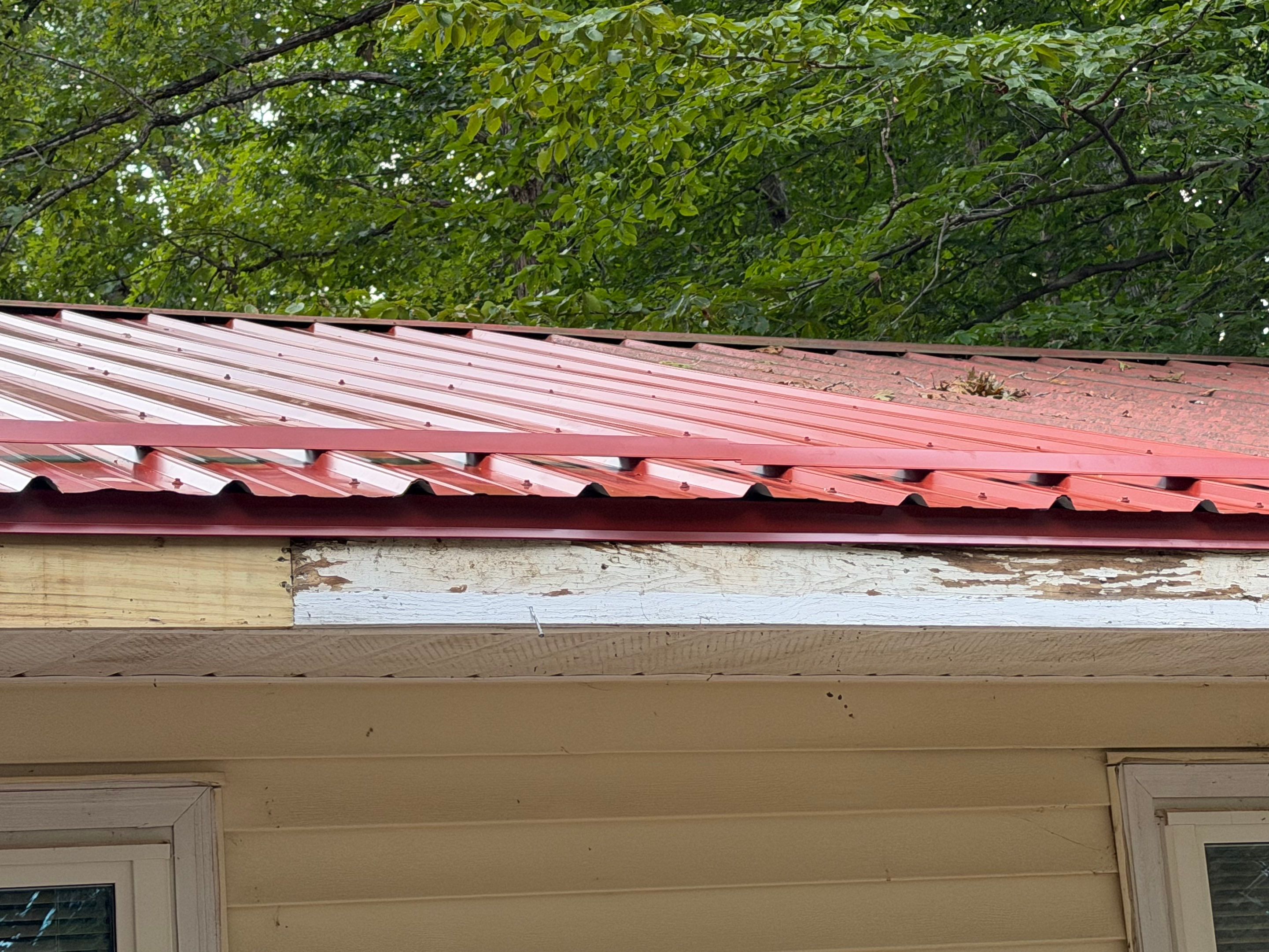 Red Metal Roof Restoration and Wood Fascia Replacement in Barboursville by Cade Construction