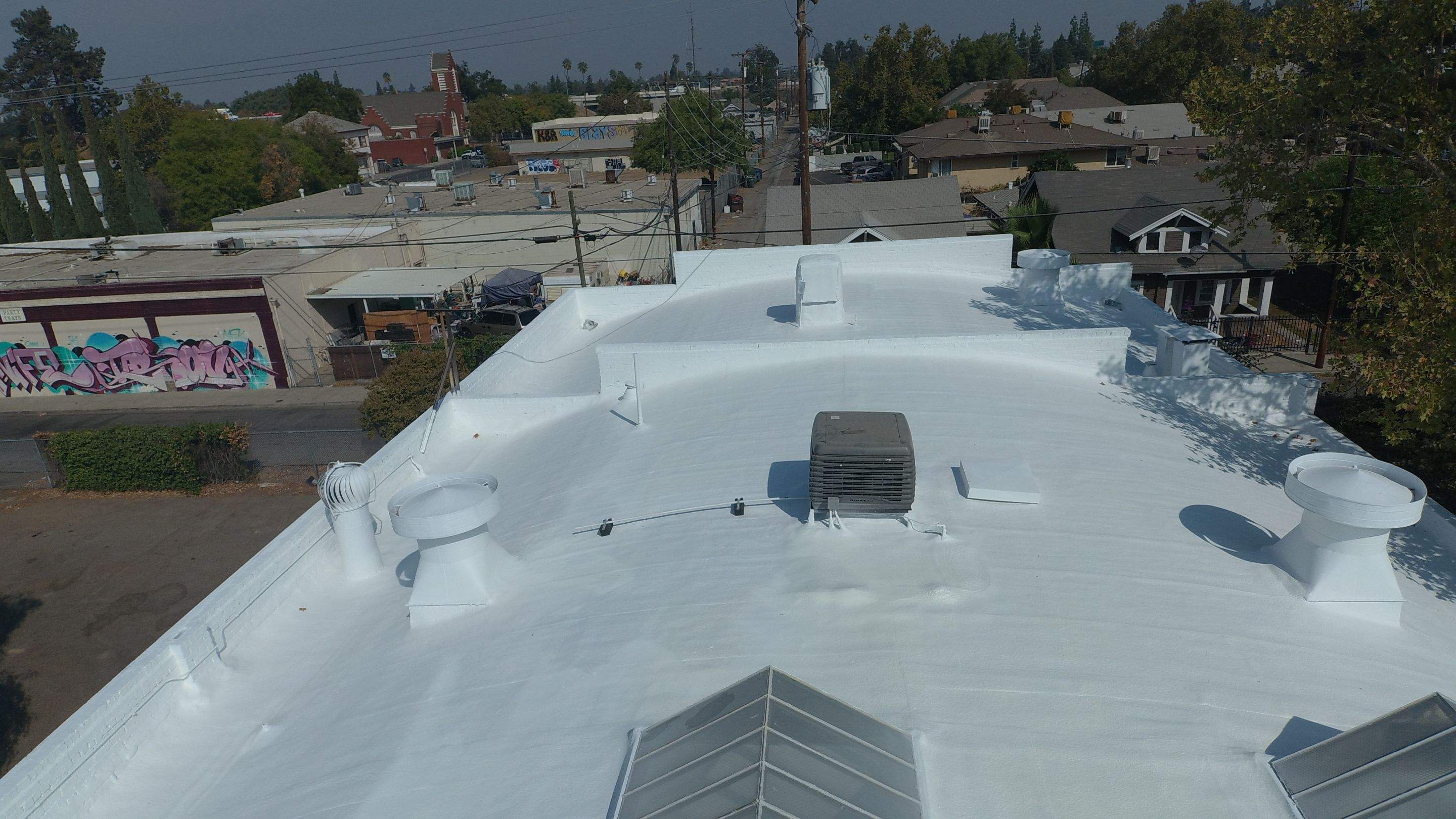 Polyurethane foam roof refurbish and recoating by Straight Edge Roofing Inc