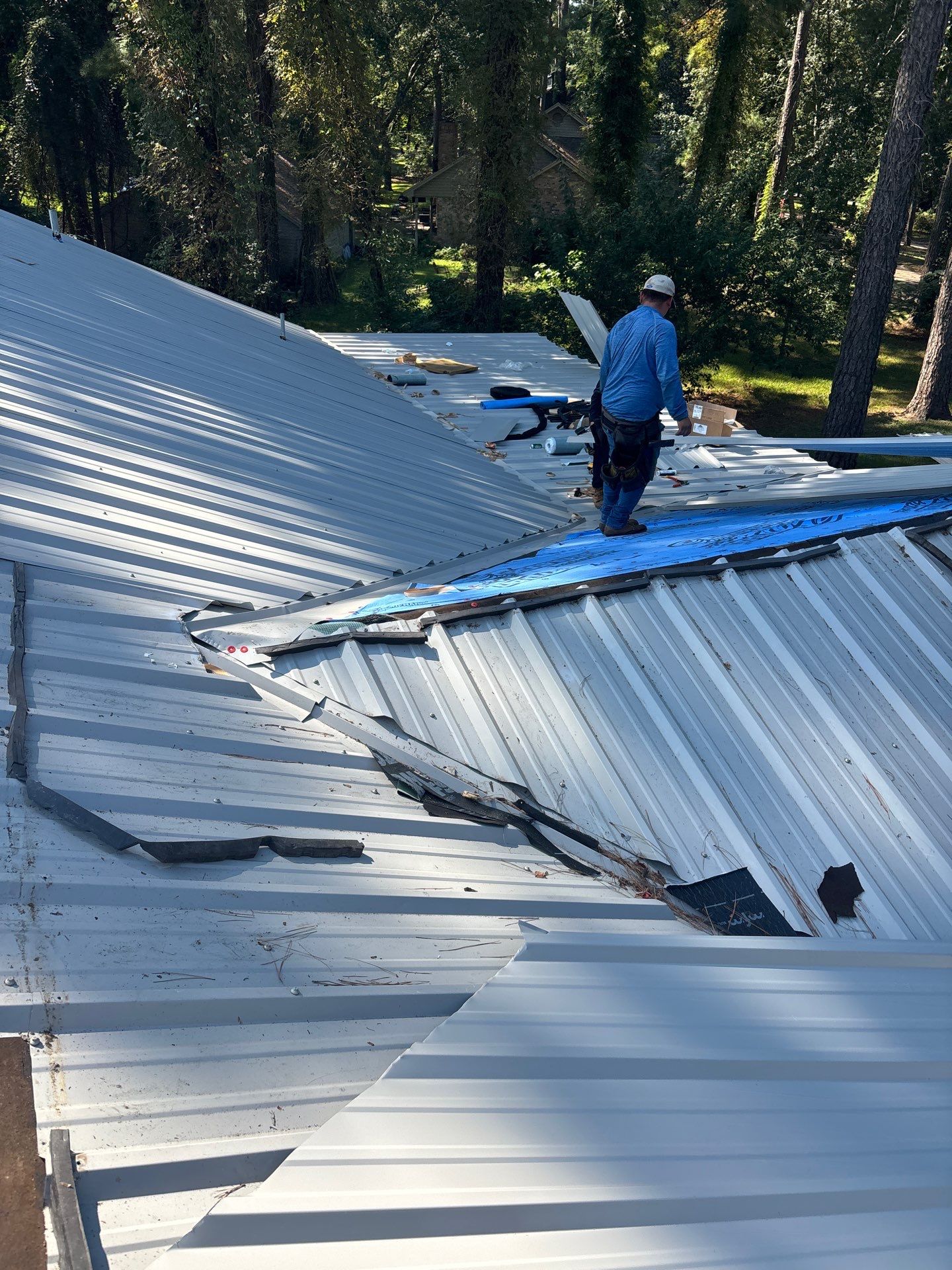 White Standing Seam Metal Roof Replacement in Willis, Texas by Abbott Roofing Company