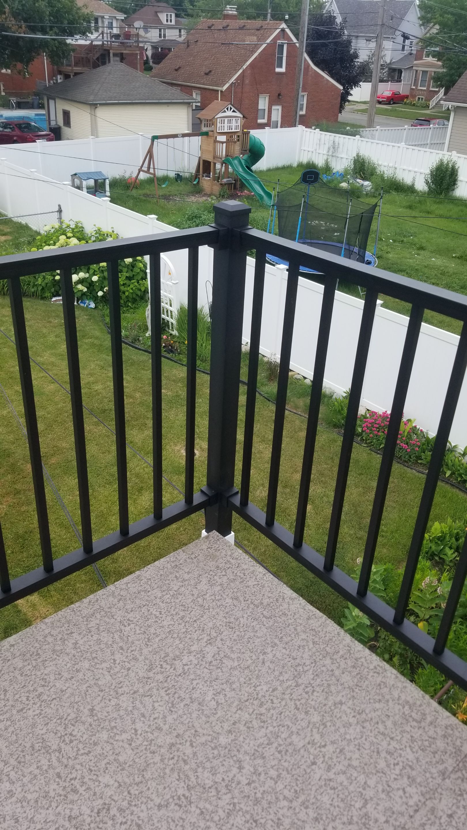 Rebuild balcony flat roofing TREX decking stairway and Railings in Wyandotte, MI by Northwest Construction 