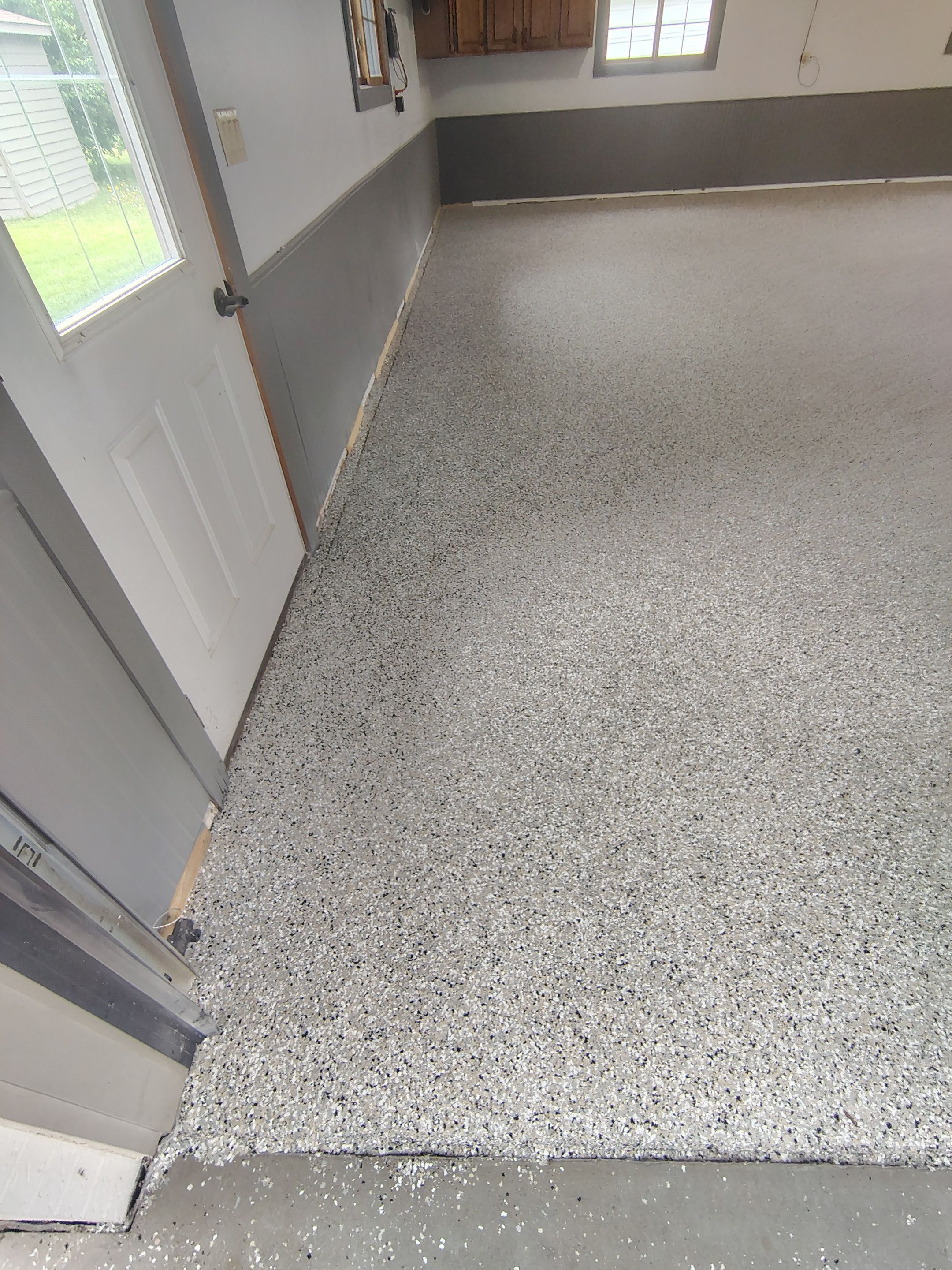 Multi-Fleck Epoxy Garage Floor Coating in Dell Rapids by Select Painting, Coatings & Garage Cabinets