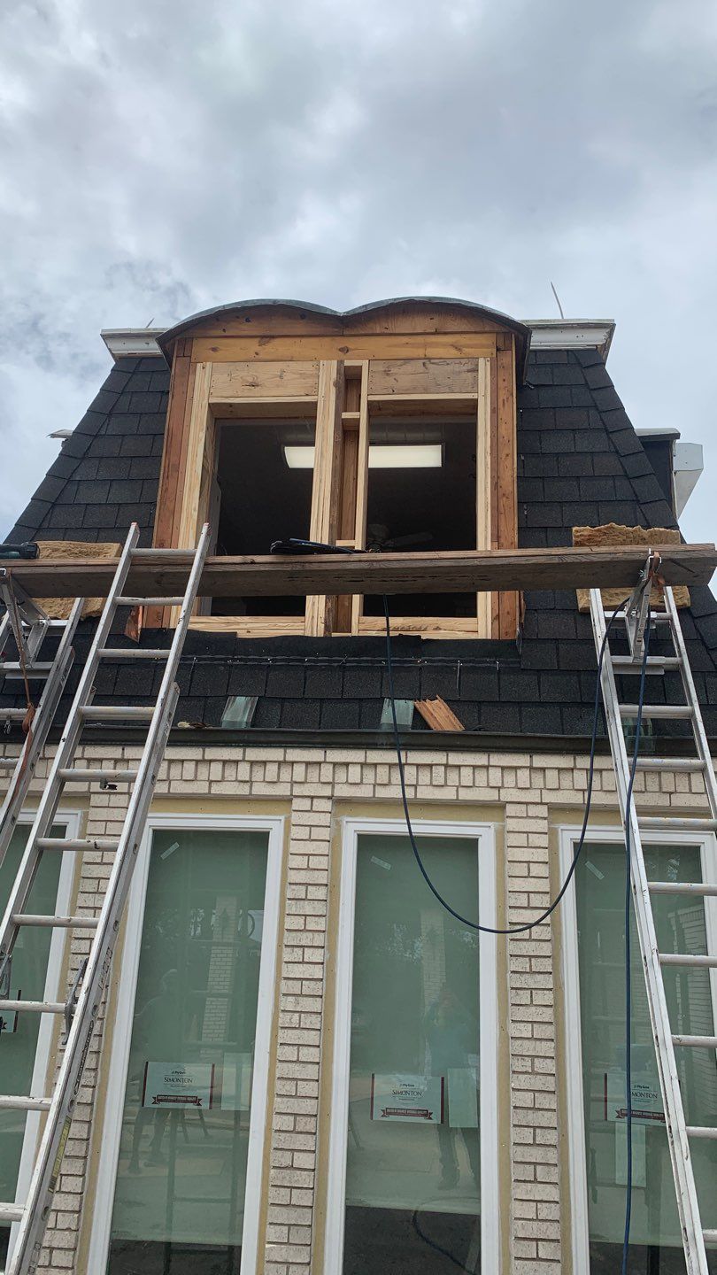 Mansard Charm by Bayfront Roofing and Construction