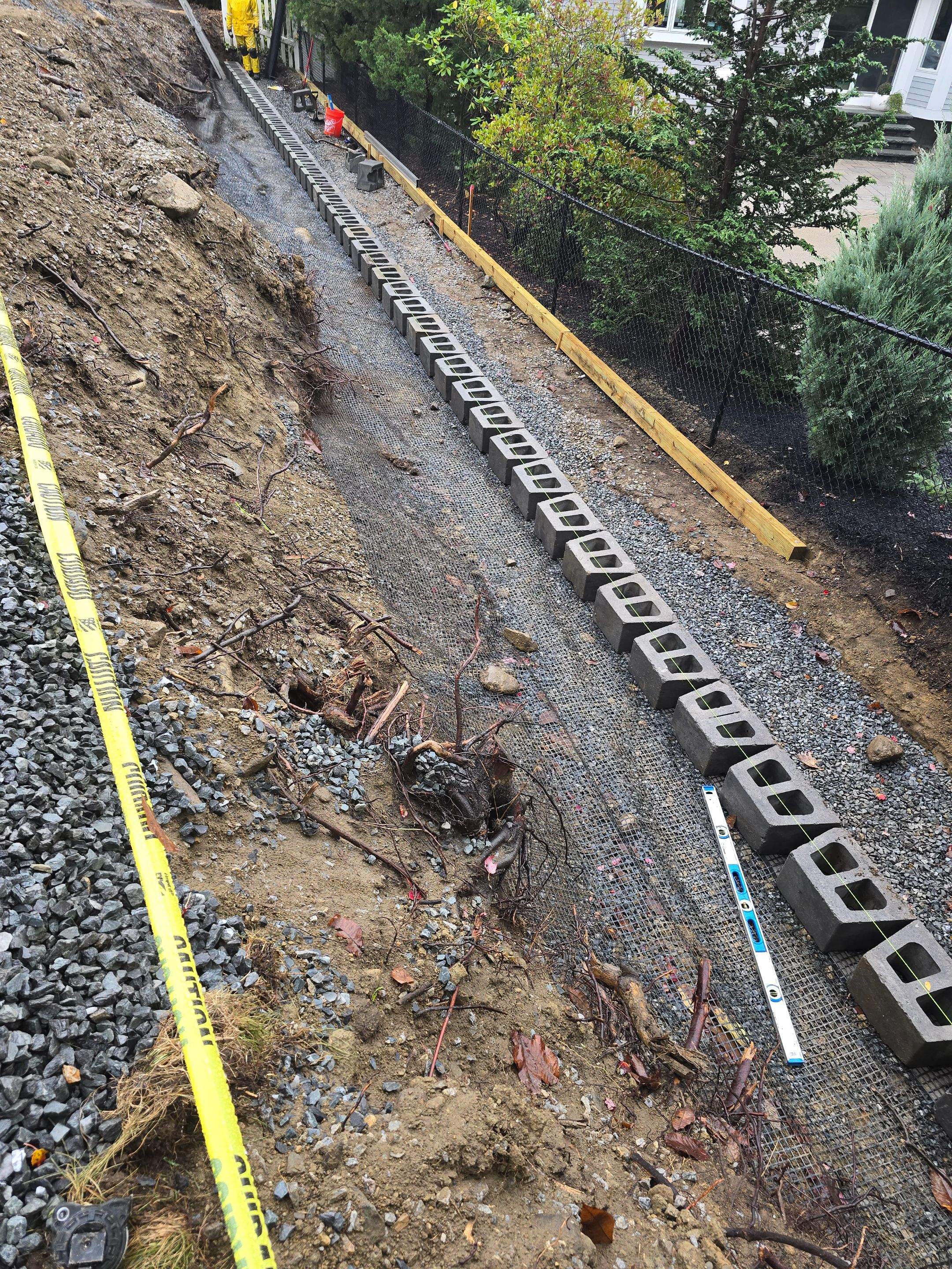 Retaining Wall to Level Backyard  by May Property Management 