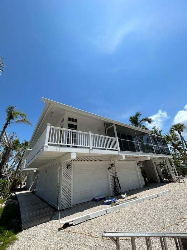 White Gutter Installation in Sanibel FL by Gutter Professors
