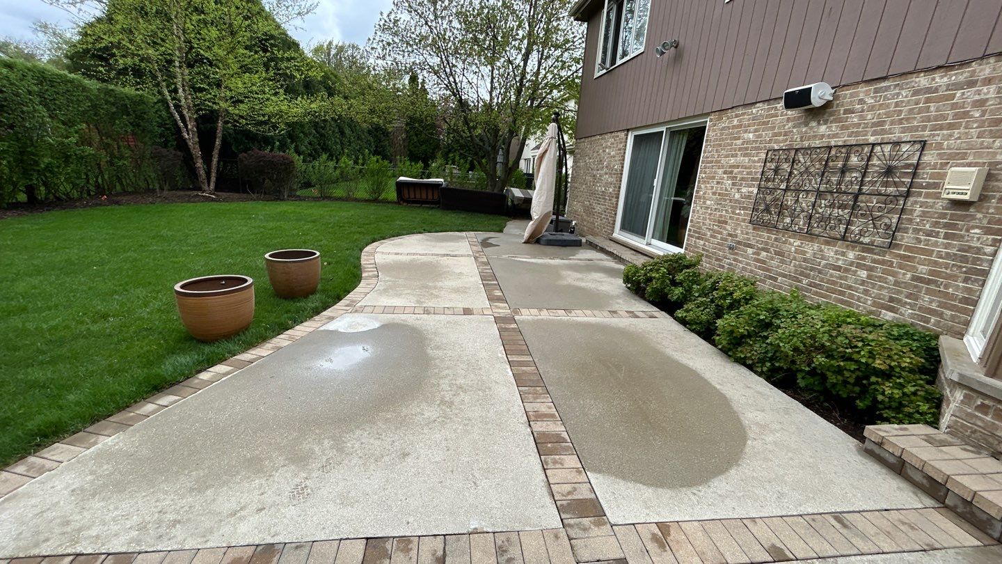 concrete patio and driveway cleaning by Northern Power Washing LLC.