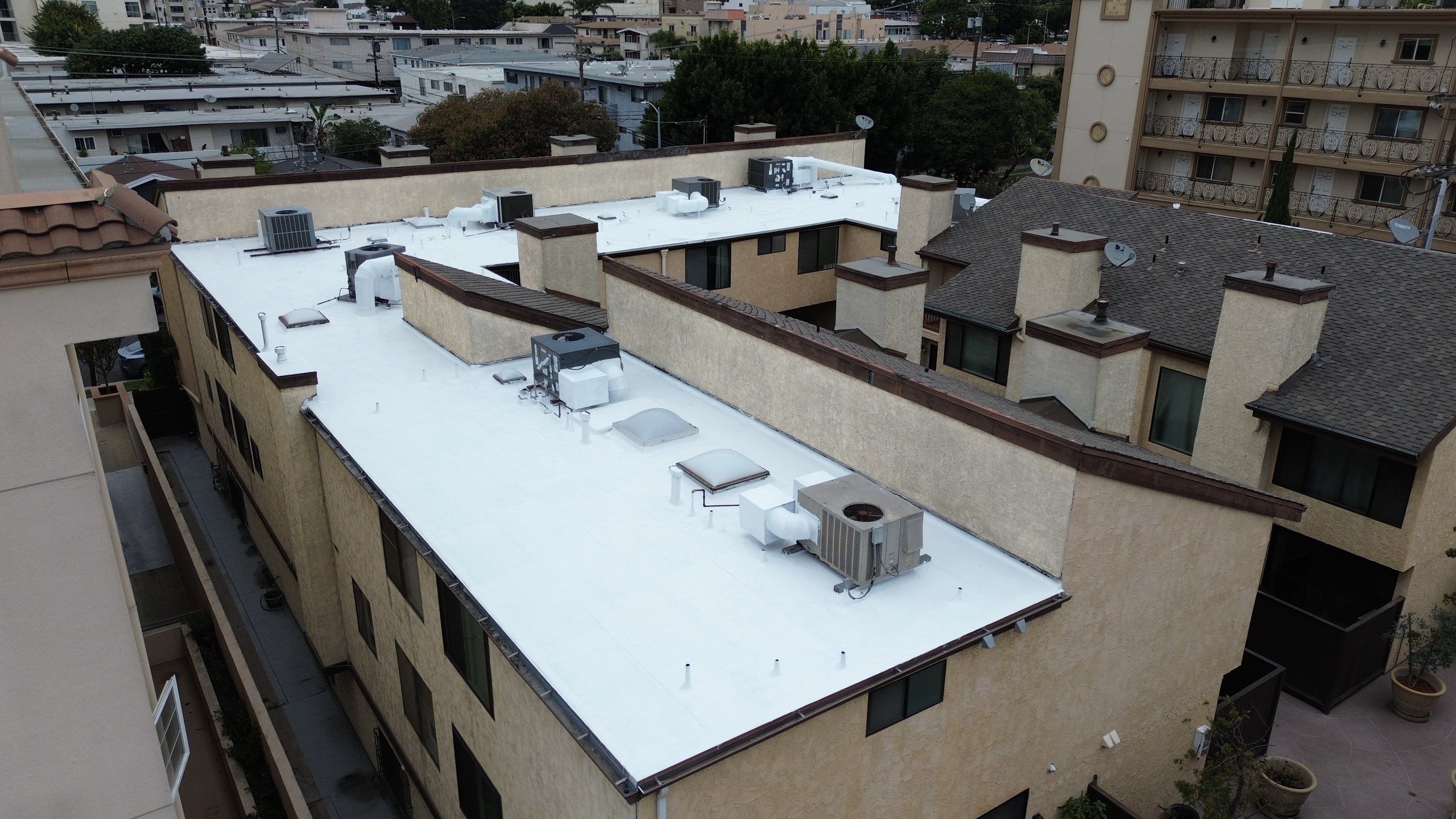 Apartment Building Silicone Coating by Hull Brothers Roofing