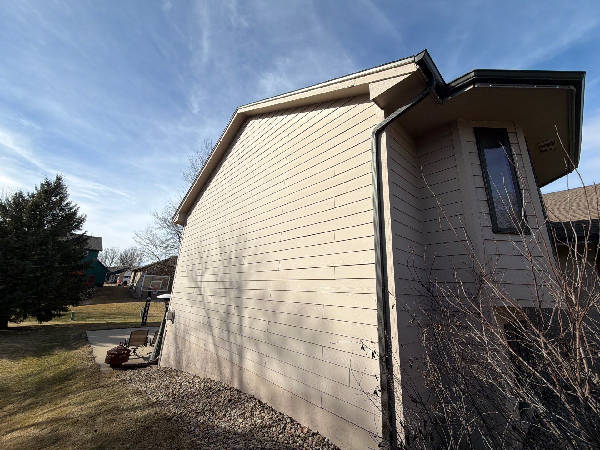 Residential Exterior Painting and Trim Restoration in Sioux Falls by Select Painting, Coatings & Garage Cabinets