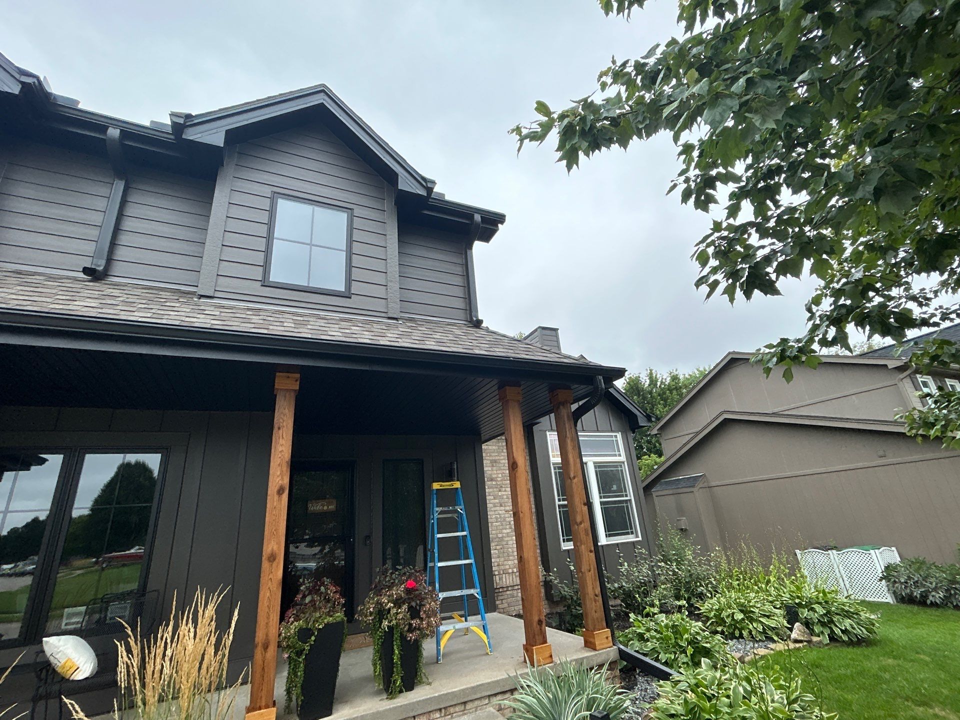 Marvin Window Replacement and Rich Espresso Hardie Siding Installation in Omaha by Carps Complete Exteriors