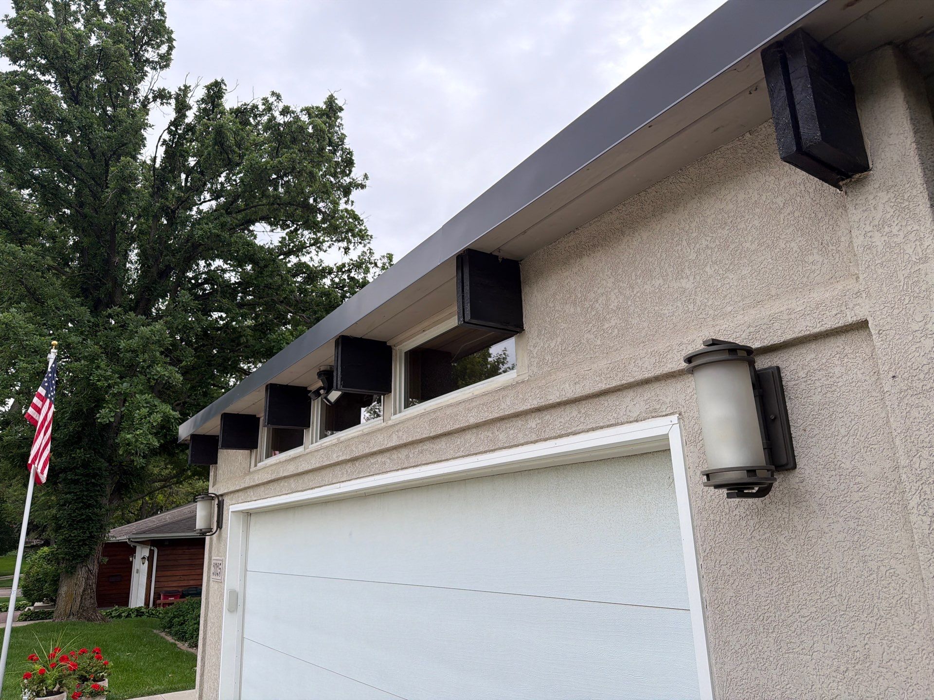 Exterior Trim Painting and Rafter Staining in Sioux Falls by Select Painting, Coatings & Garage Cabinets