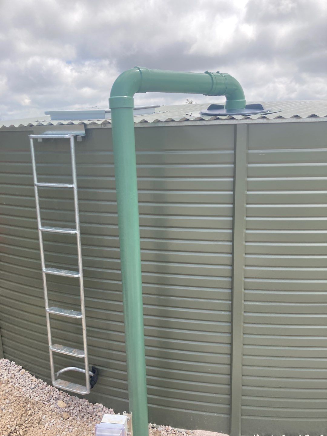 Residential Rainwater Collection System - Pioneer 40K gallon water tank in Mangrove Green by Hill Country Rain Water